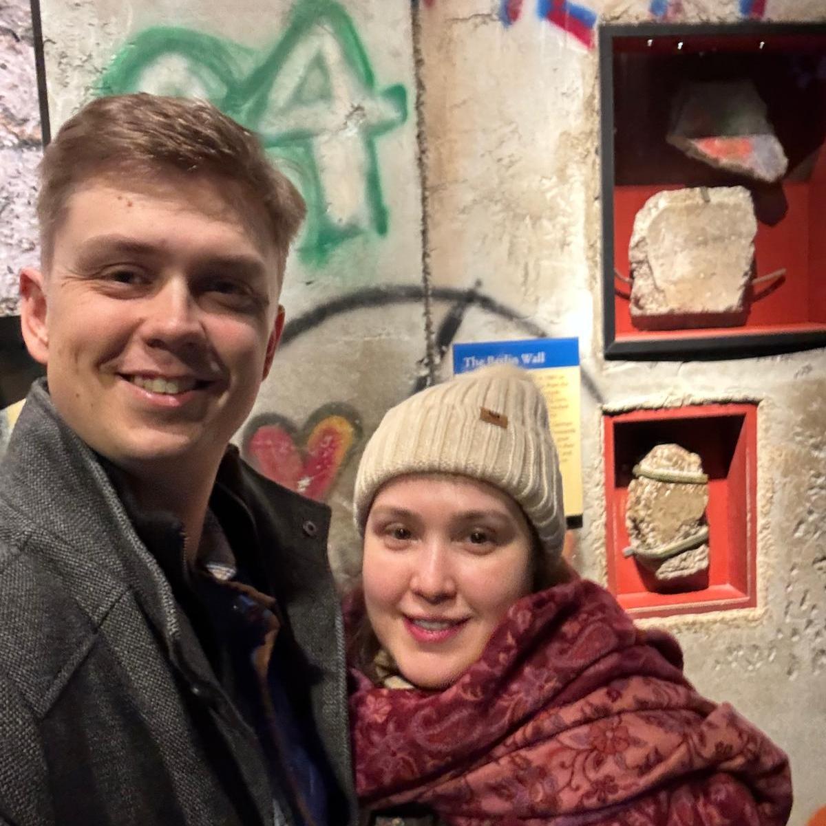 Kutsev and Eric love their DC family of friends that Kutsev made when she lived there while working at NIH (pictured is a piece of the Berlin wall at the Smithsonian)