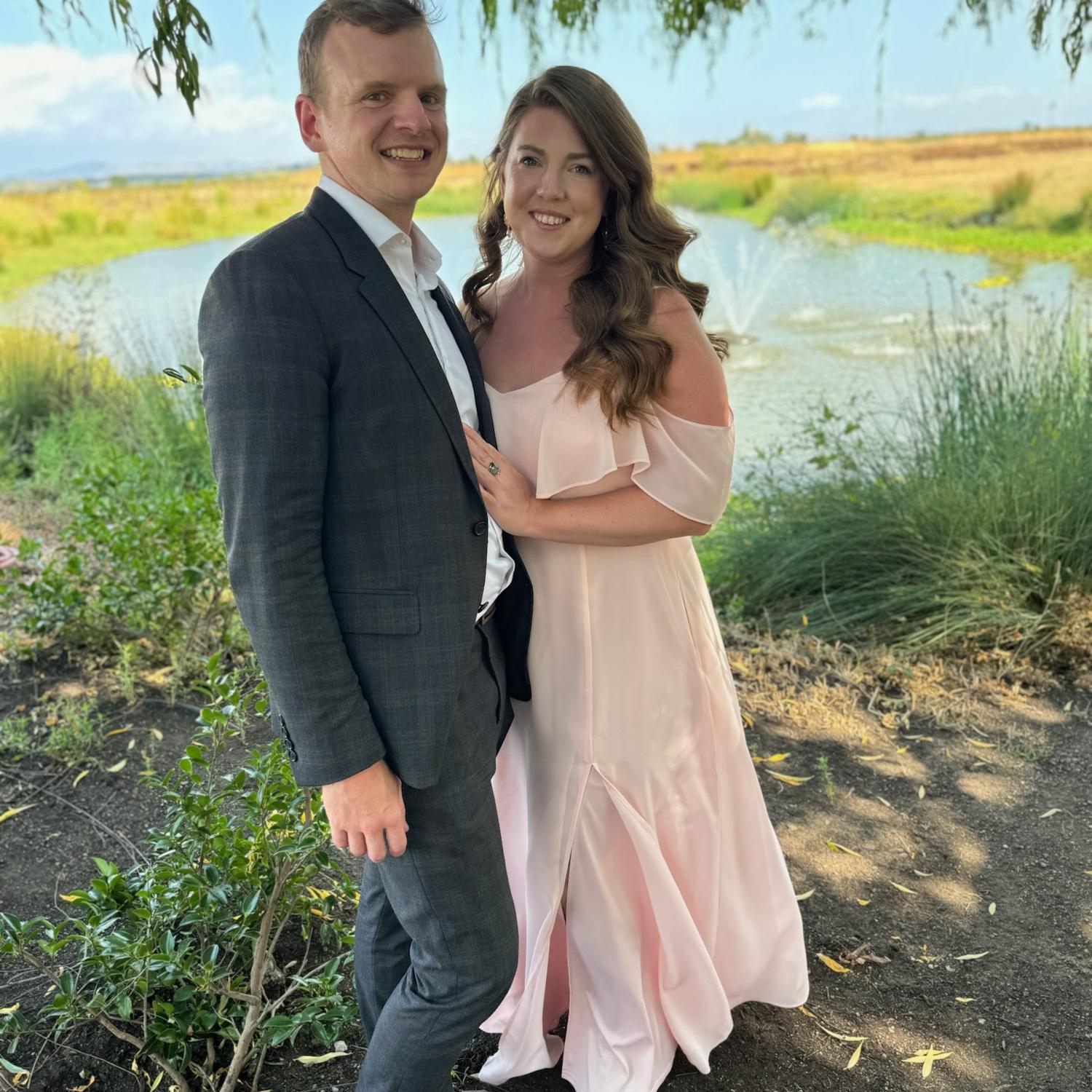 We're grateful to Kelly who took this sweet picture of us at Emily and Joe's wedding in 2024. Ryan proposed the next day.