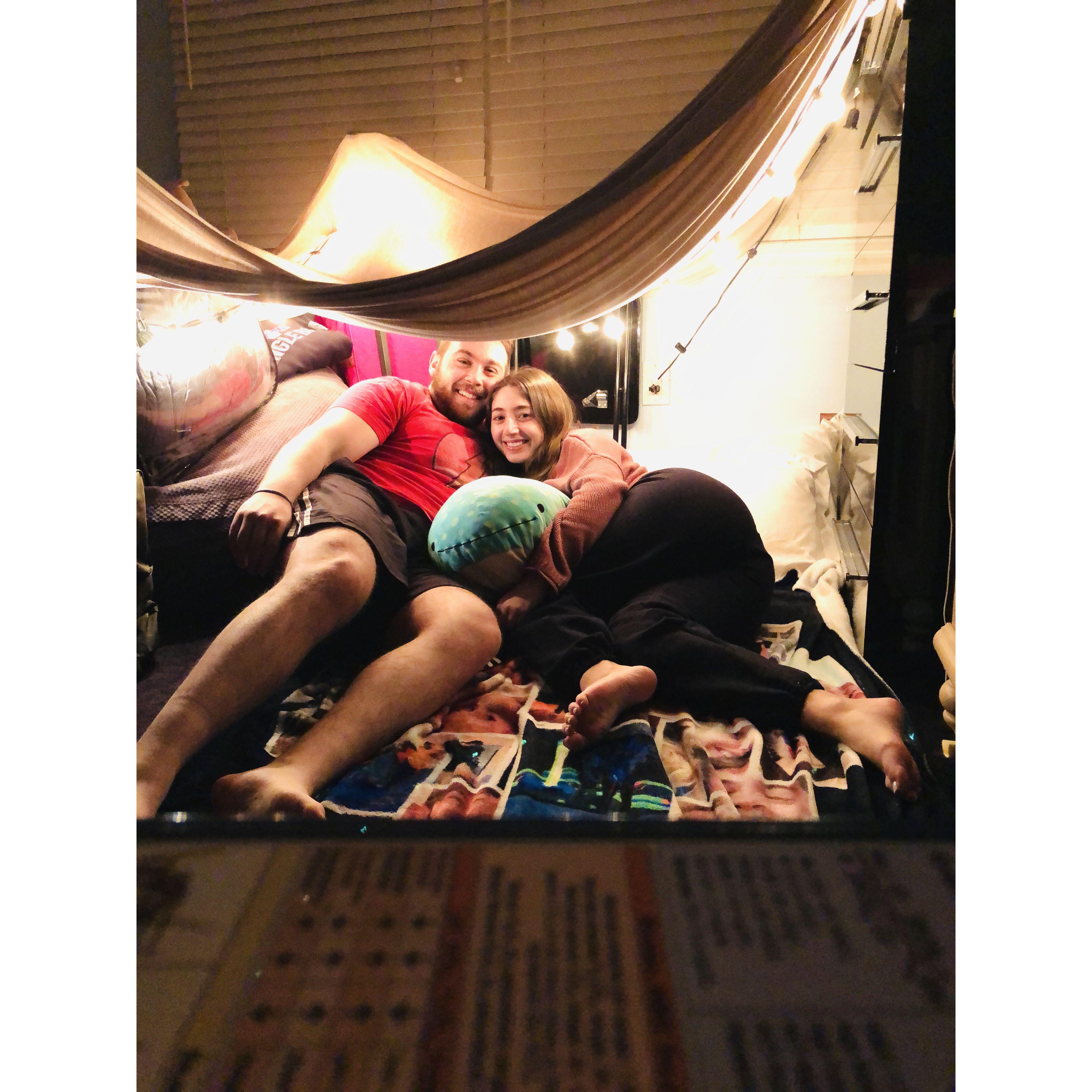 Due to COVID lockdowns, the pair decided to construct the perfect pillow and blanket fort complete with twinkly lights, smores, and lots of movies!