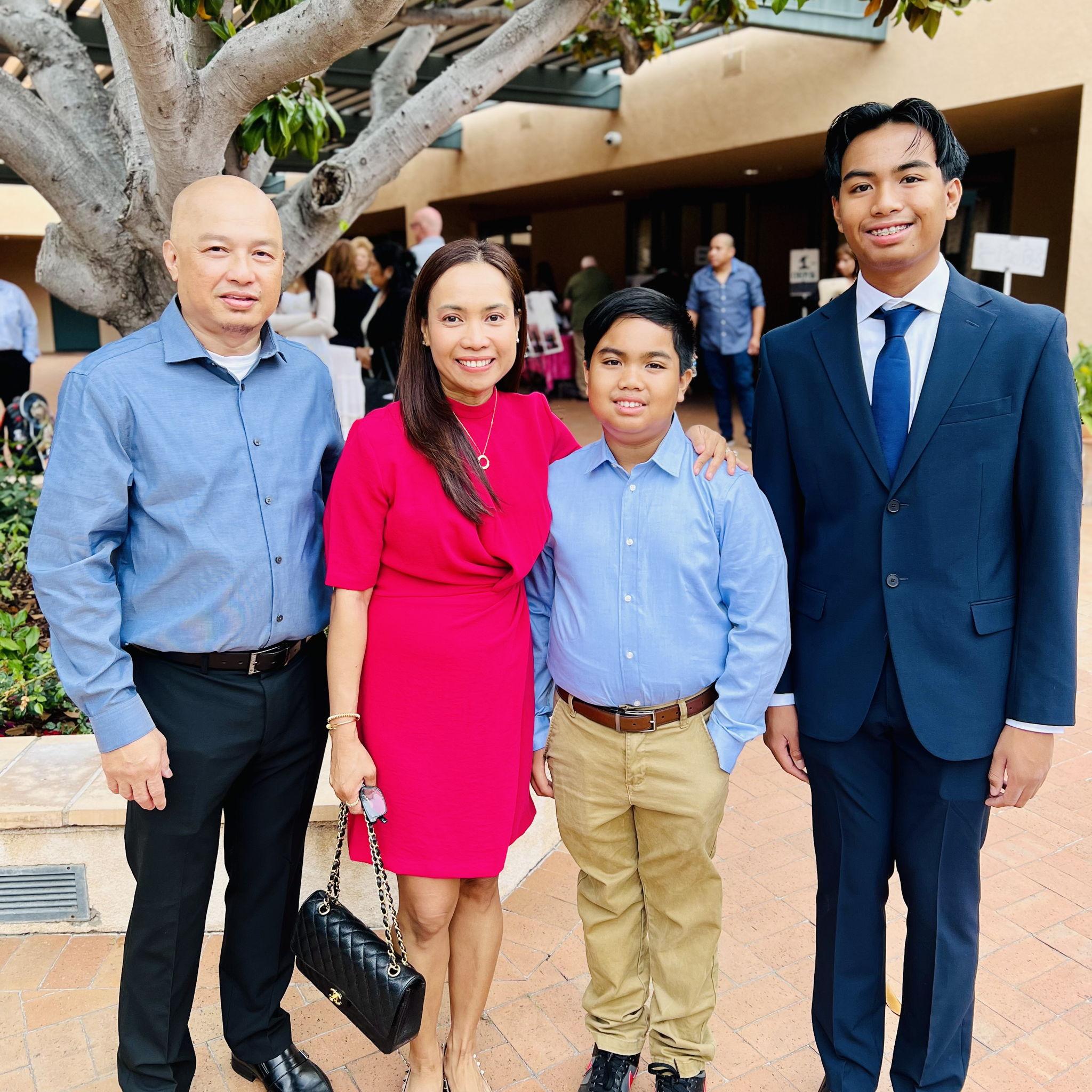 Jill, with her husband Roy, and their sons Angelo and Luis.