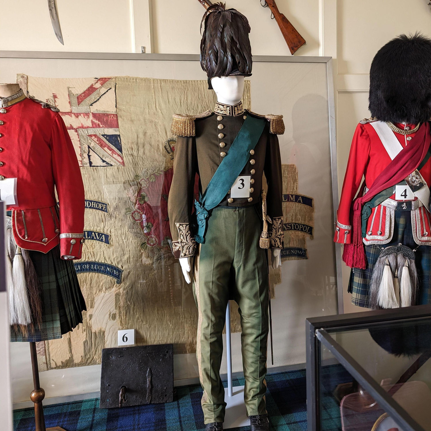 An all green military uniform.