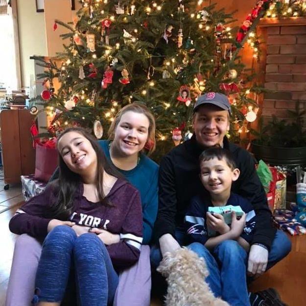 Sophie, Carol, Jason, & Xander pose for a pic before getting to the presents