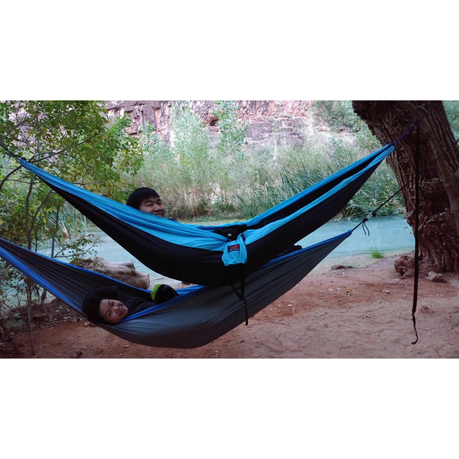 2 humans, 2 hammocks.