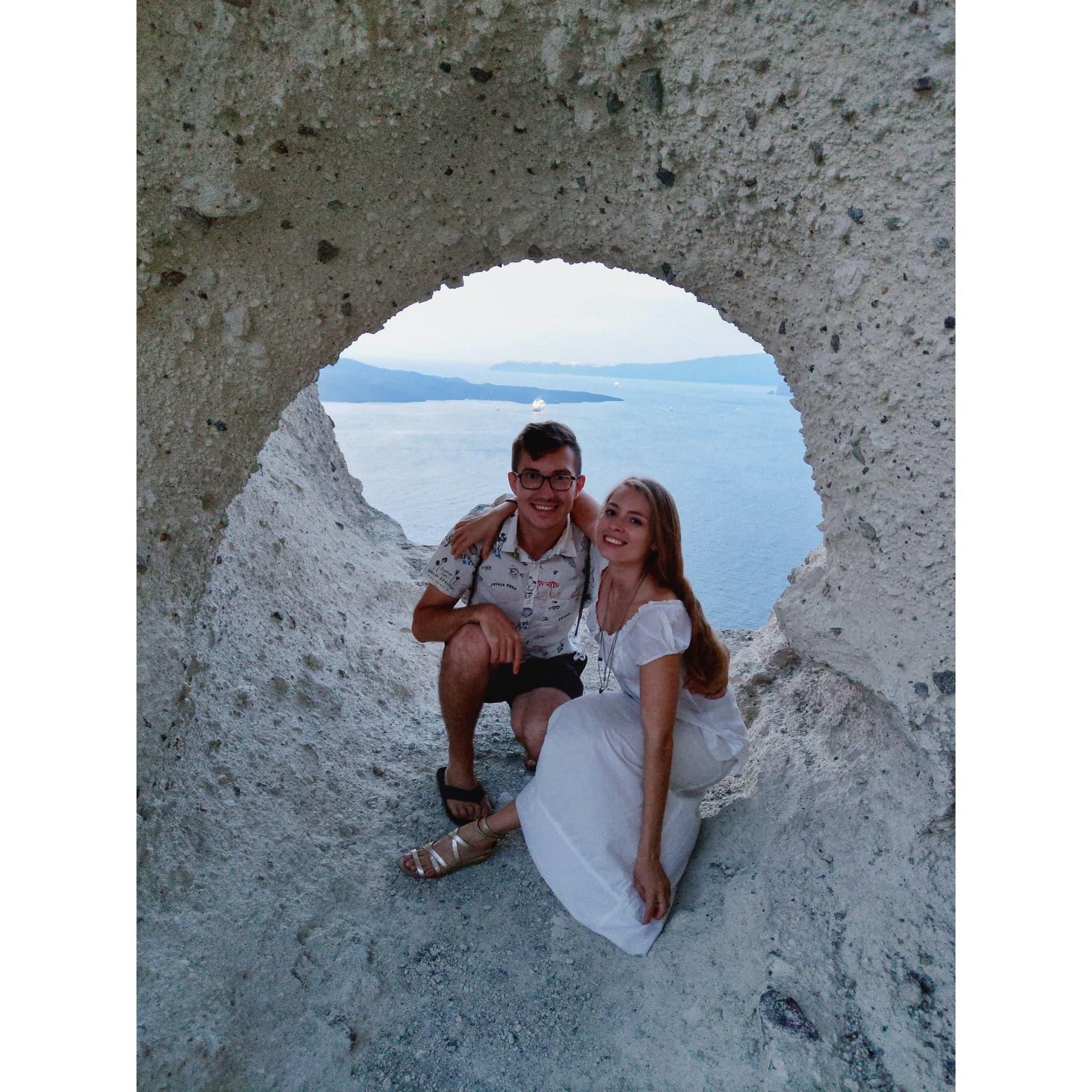 This opening in the mountain is shaped like a heart and has earned it's name as The Heart of Santorini. Don't be fooled by our smiles, there is an endless drop behind us - scary!!! (September, 2018).