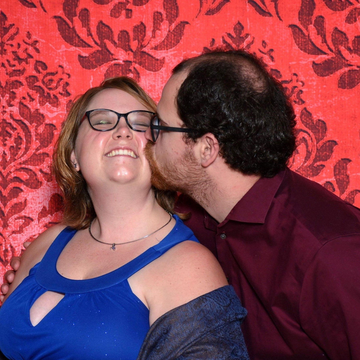 Stealing a kiss from her