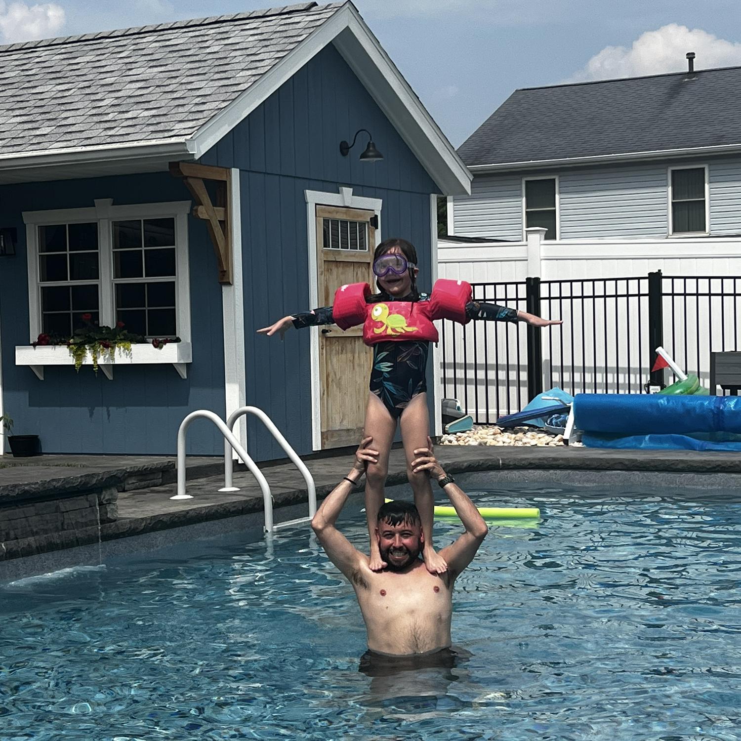 Chloe and Jeremy having fun in the pool.