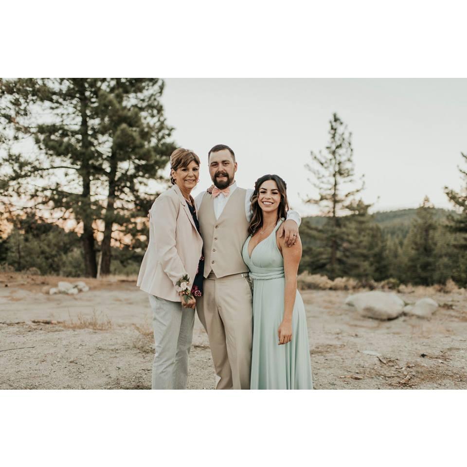 Gabby at her sons wedding. Image includes Gabby, Nick, and daughter Patricia