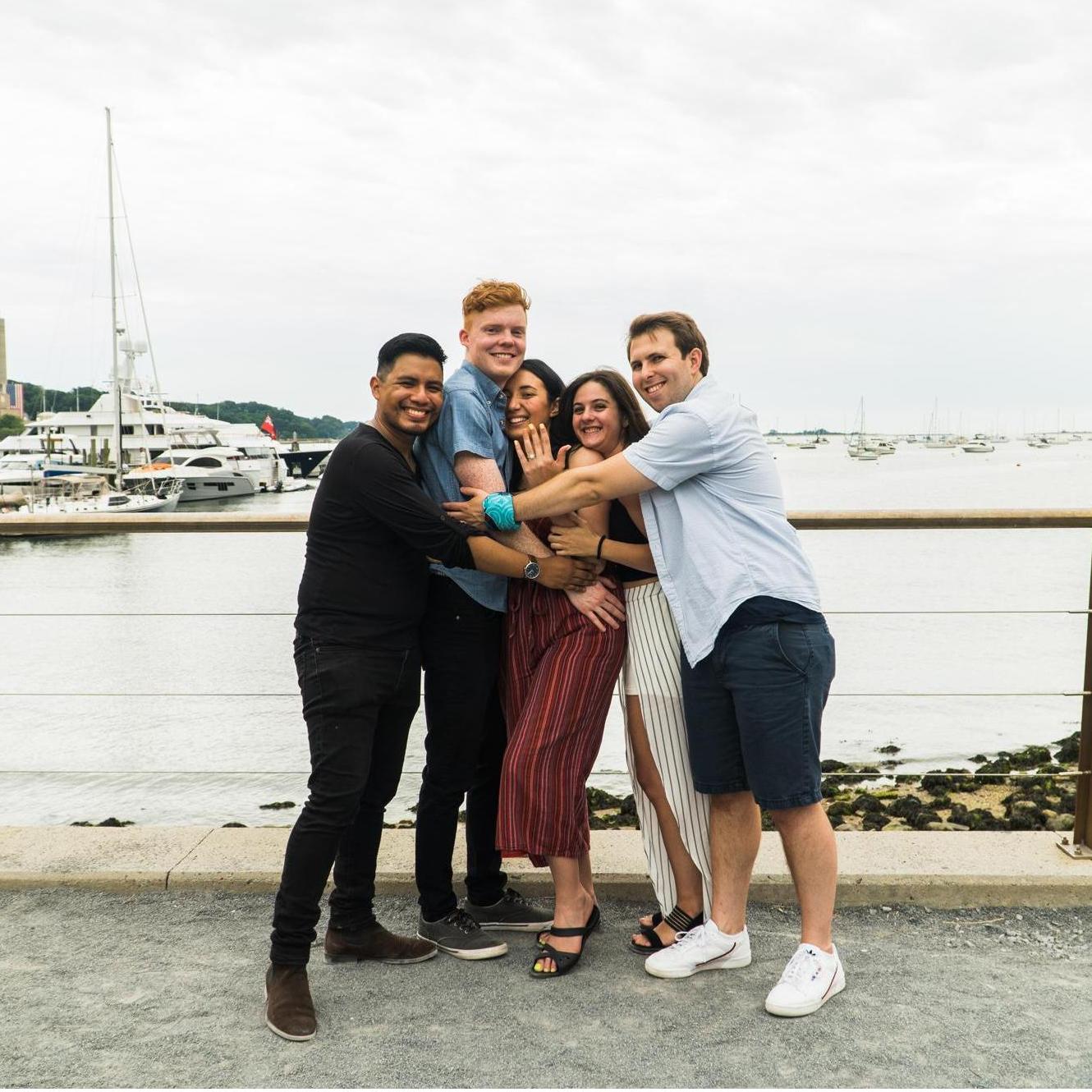 The couple and friends celebratory hug.