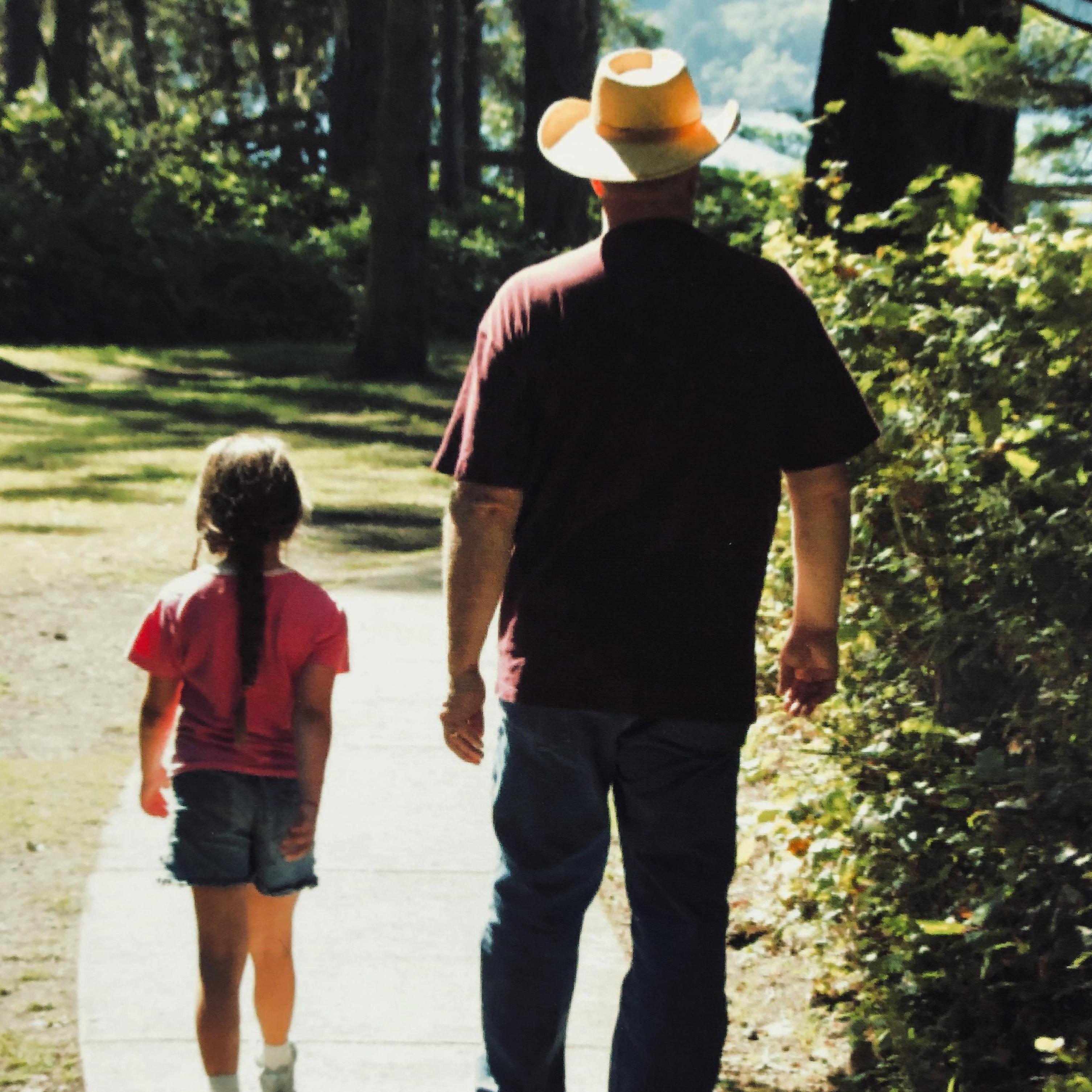 Faith and Greg (Officiant) taking a walk when Faith was 8