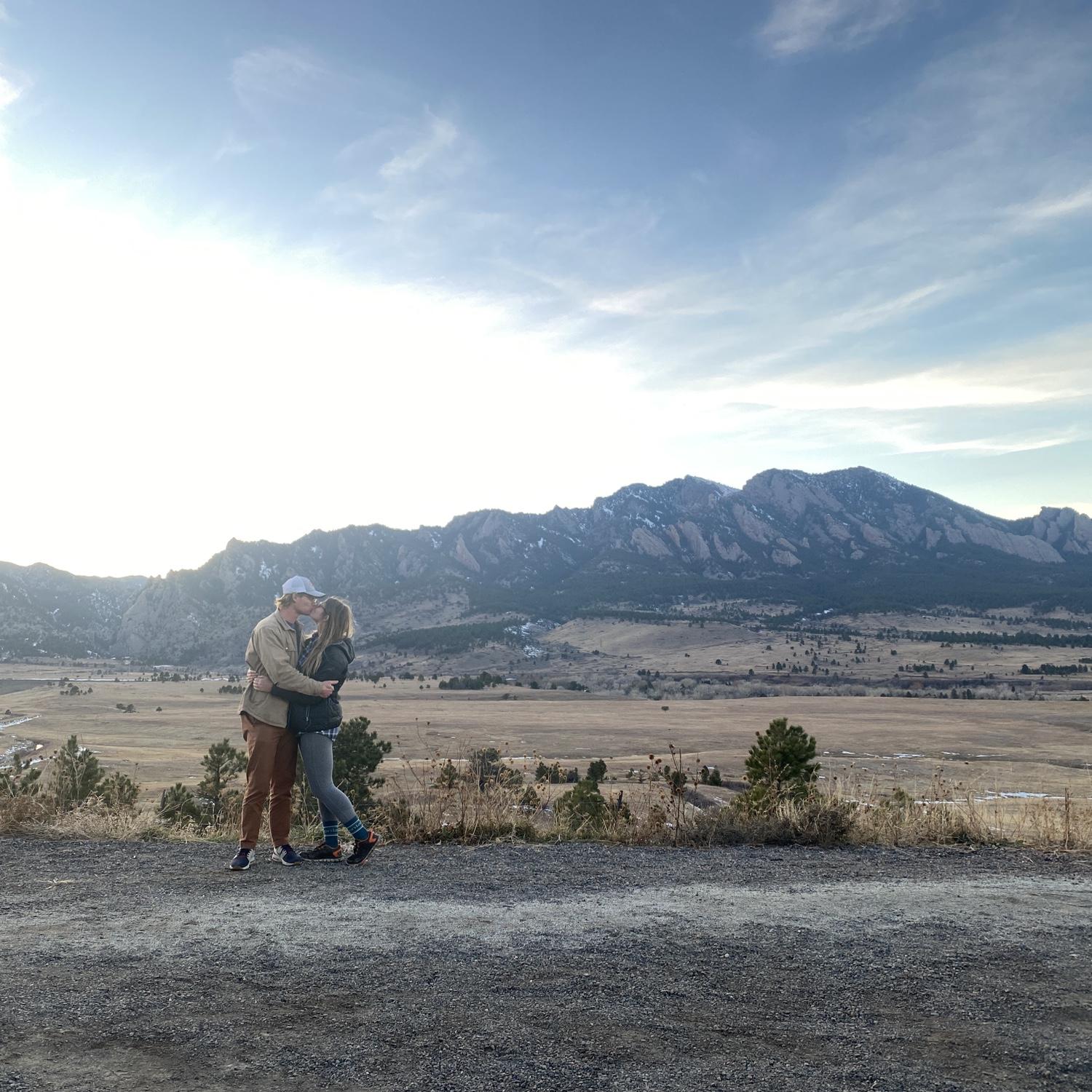 Revisiting our engagement spot in front of the Boulder Flatirons