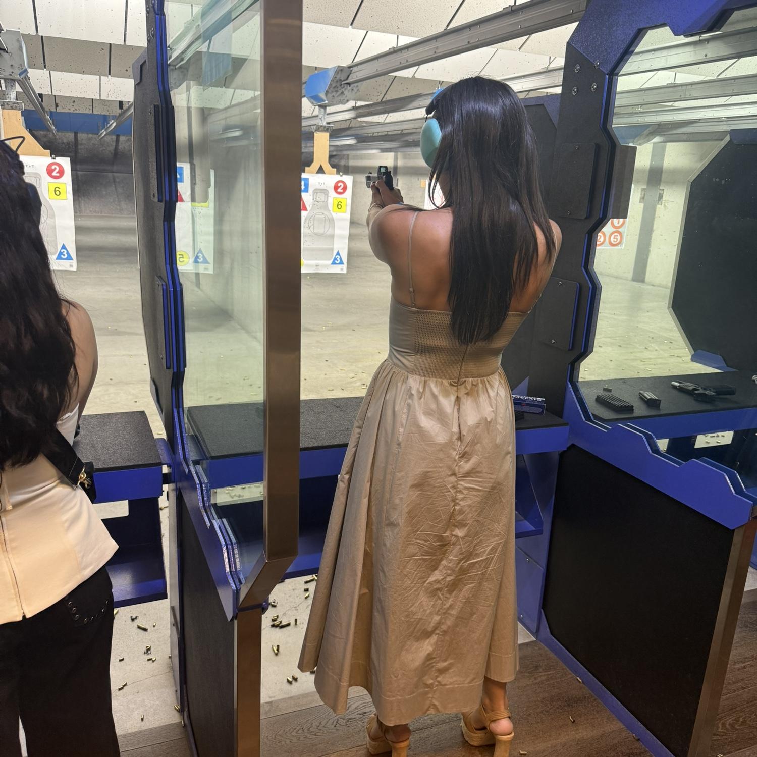 Heels, dress, and the shooting range.
