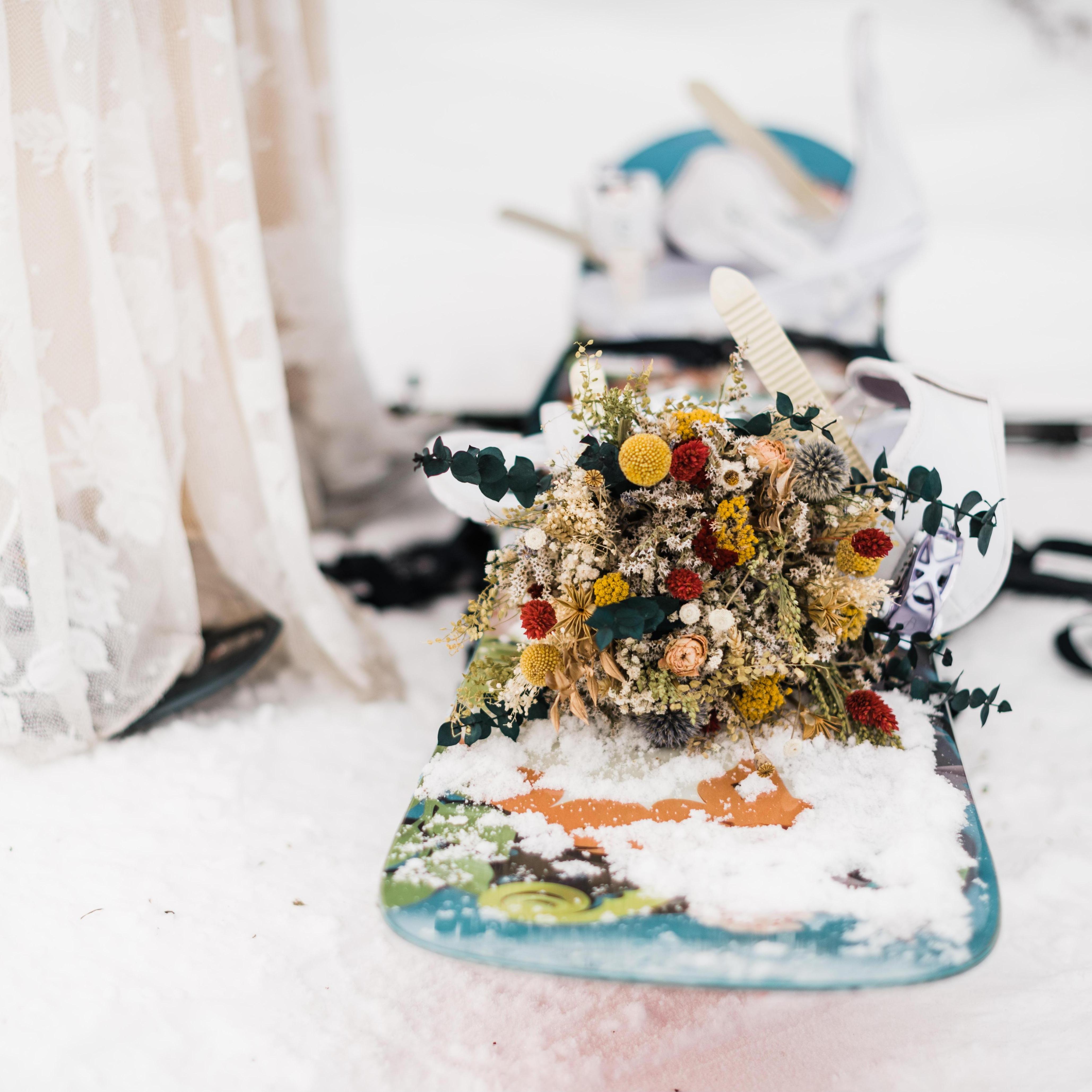 Dried flowers are so hardy! Tori’s bouquet survived a cold day of sledding, hiking, and snowboarding.