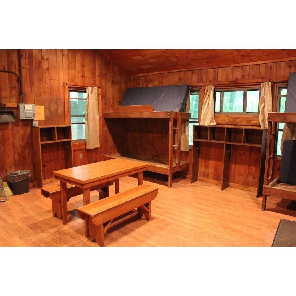 Interior view of the cabins, where you are welcome to stay overnight for $30/cabin. All cabins have a similar interior and fit about eight people. You will need to bring a sleeping bag & pillow.