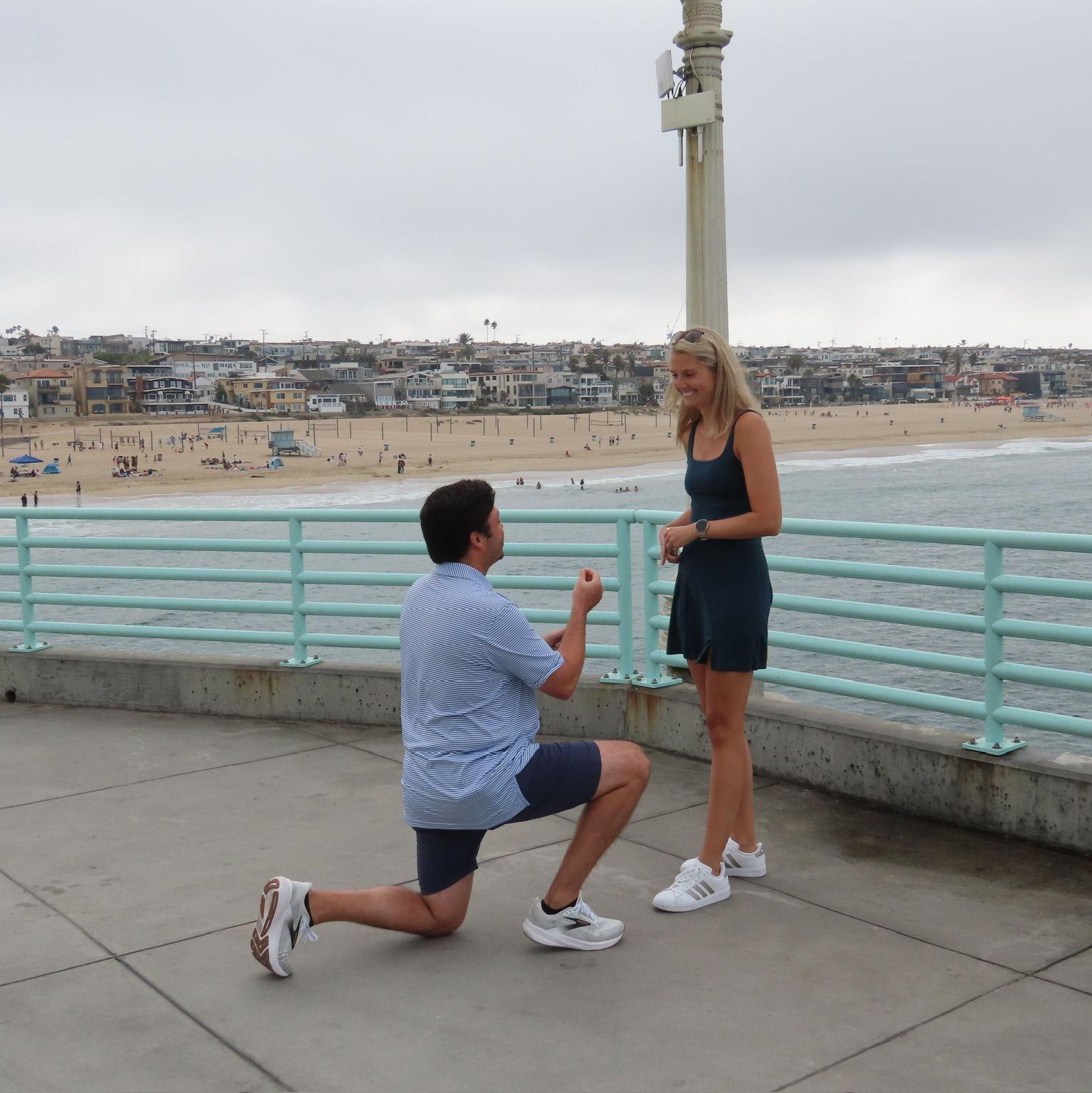On the pier in Manhattan Beach, CA where Jeffrey popped the question!