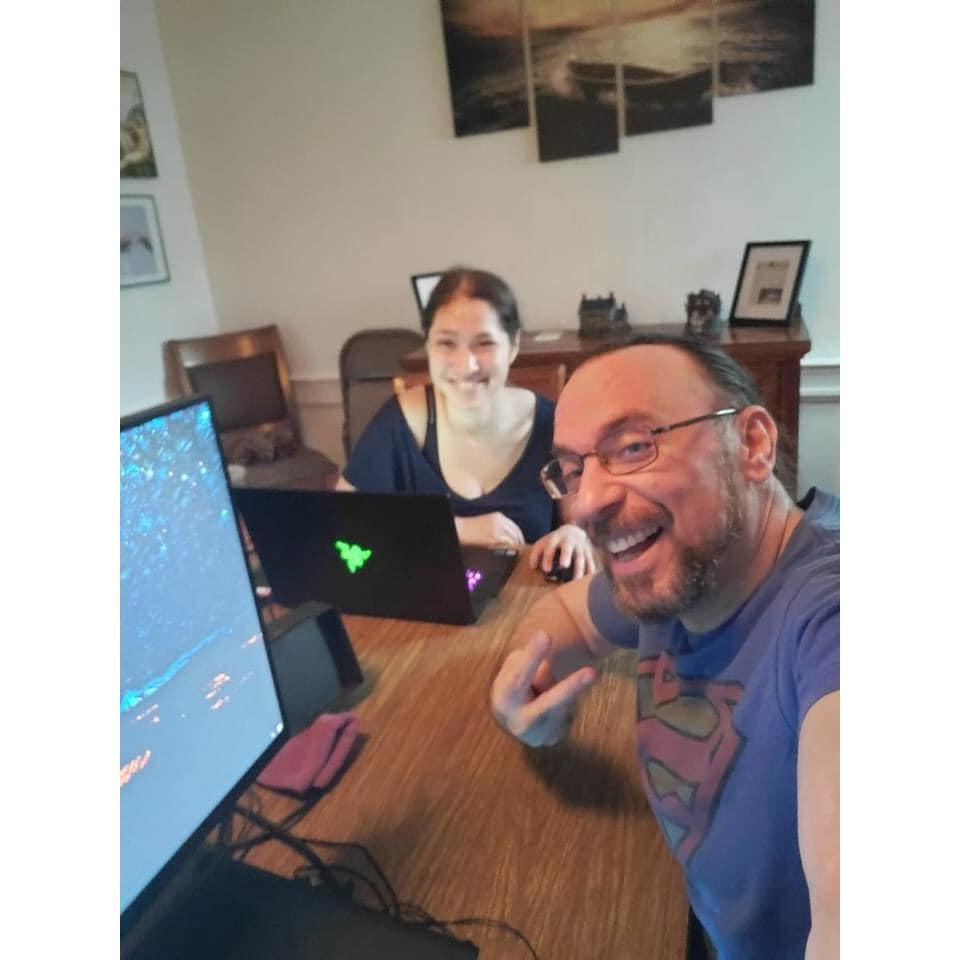 Damon introducing Natalie to the gaming world.