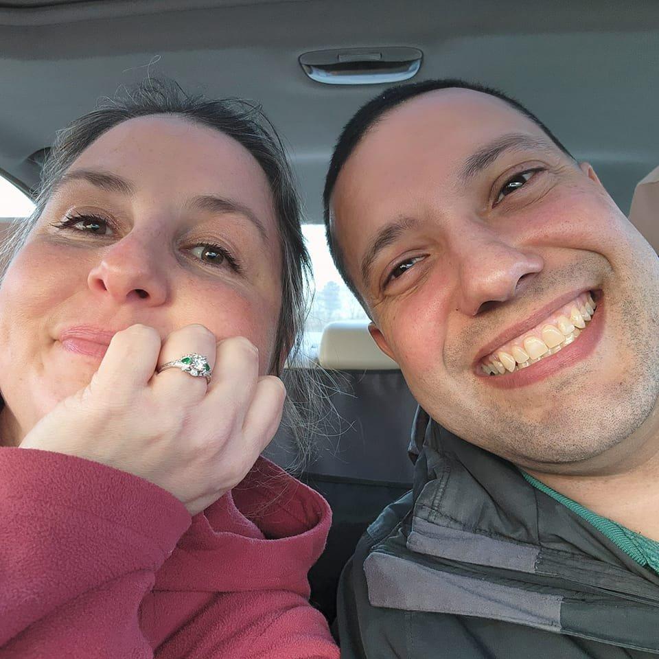 Our "Hey, look! We're engaged!" pic while warming up in the car.😍