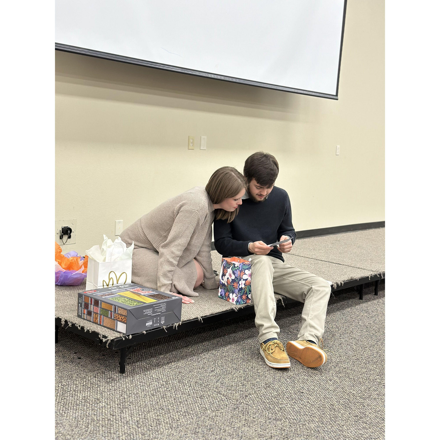 Opening gifts at our engagement party in Midland