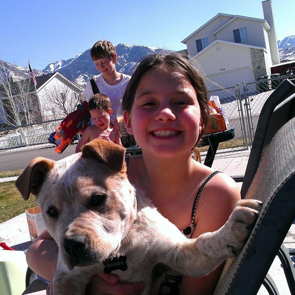 Savannah and her puppy Rowdy! Of course her two brothers are in the back playing with water guns!