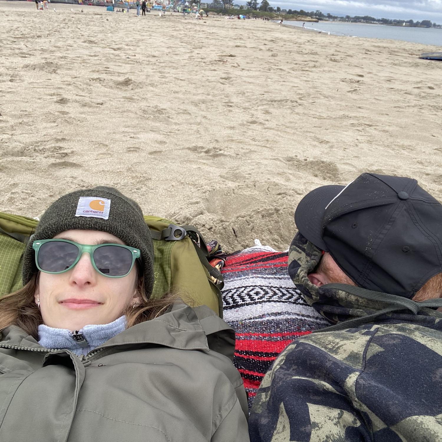 Taking a nap on the beach at the Boardwalk.