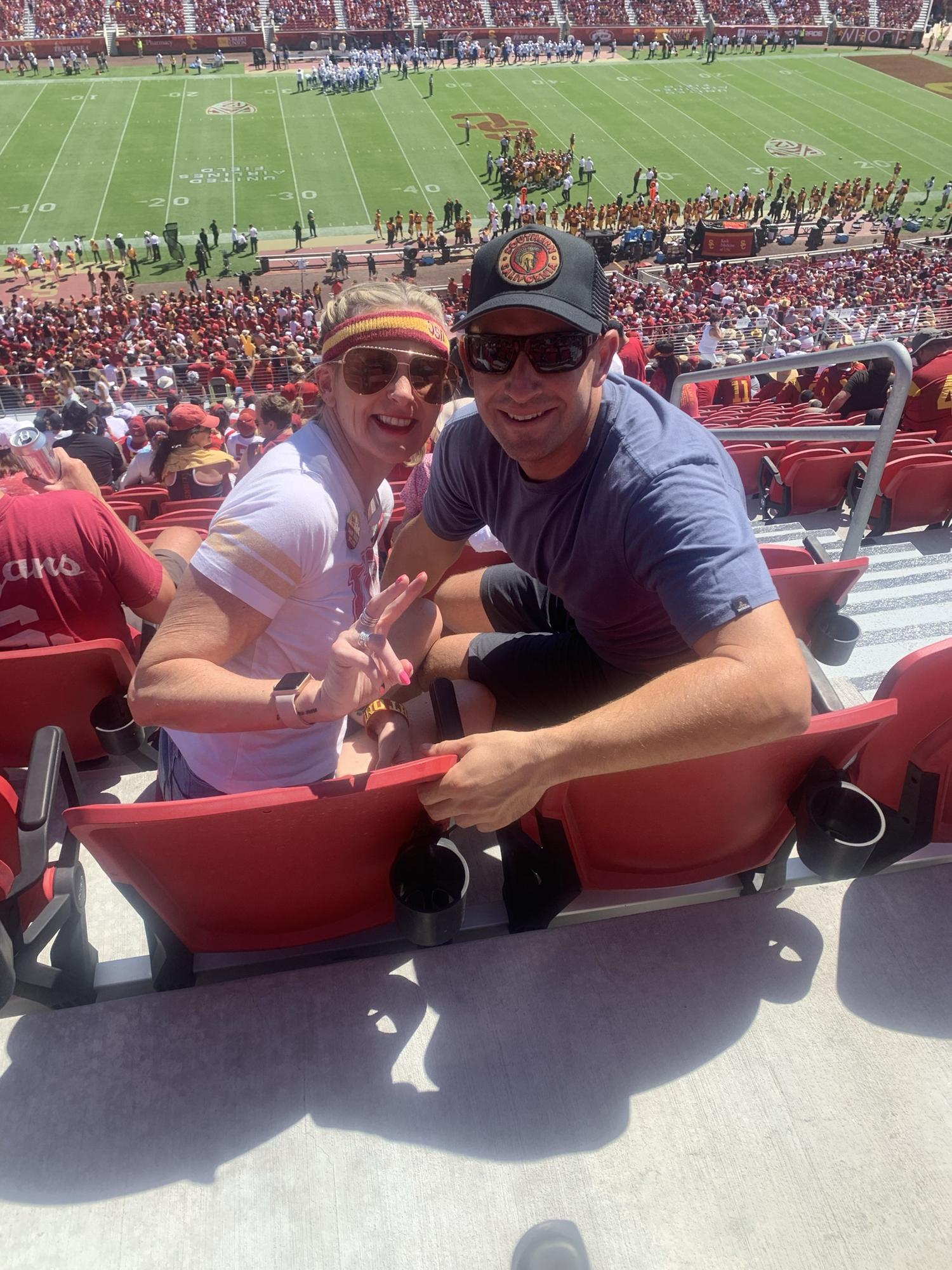 Fight on! Although Wes is a UCLA fan he braved the heat and his pride to attend a USC game with Amy.