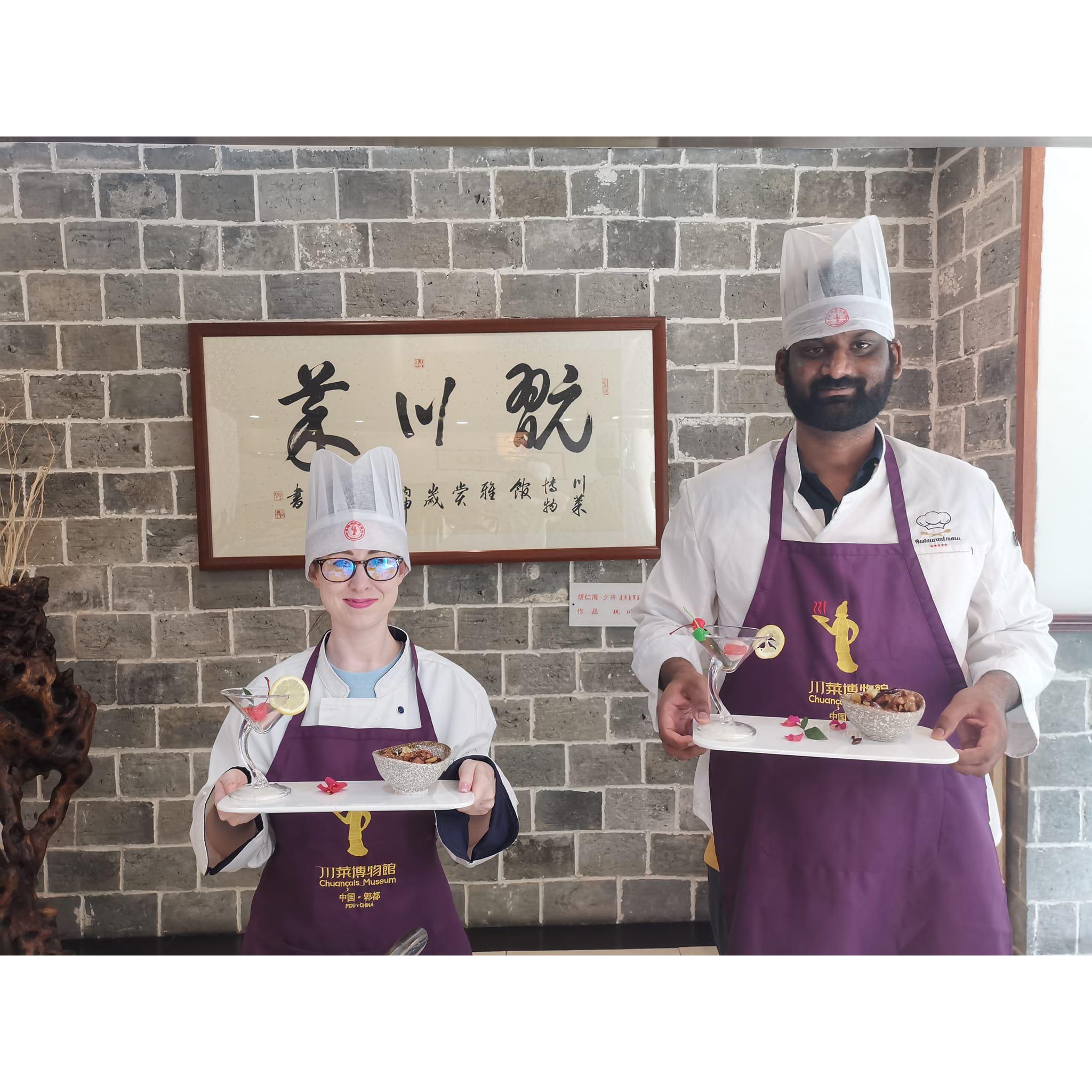 Raj and I holding the meal we just cooked at Sichuan style cooking class :)