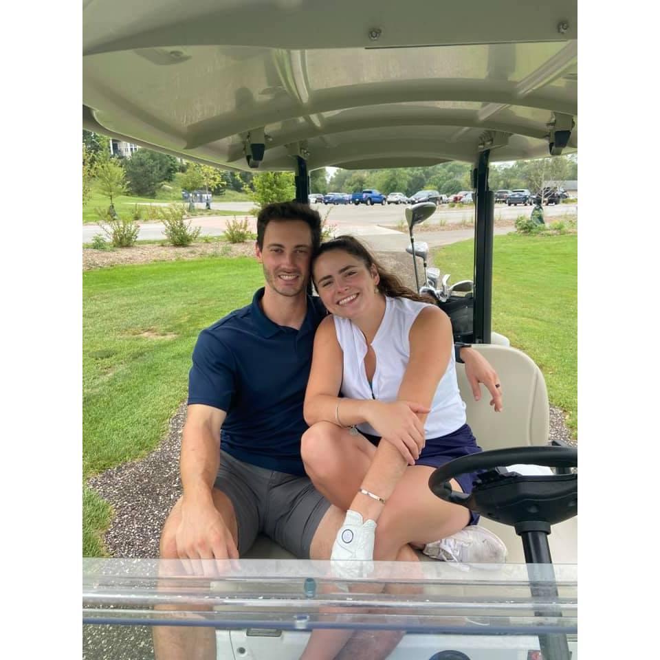 Ashley showing Dan how to golf for the first time!