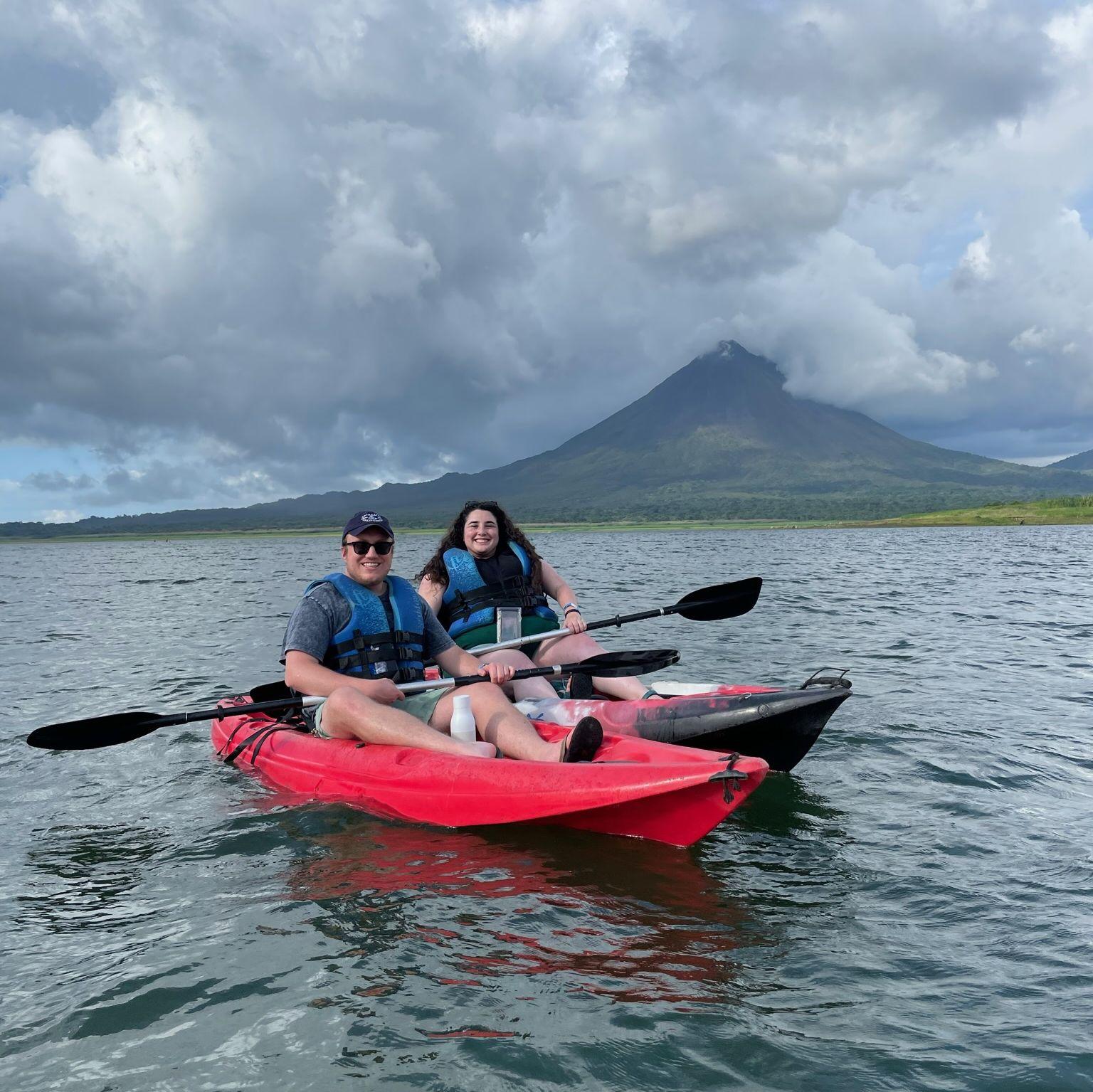 Kayaking on Lake Arenal with the Arenal Volcano behind us. Peyton's seat was just a lawn chair strapped to a kayak.