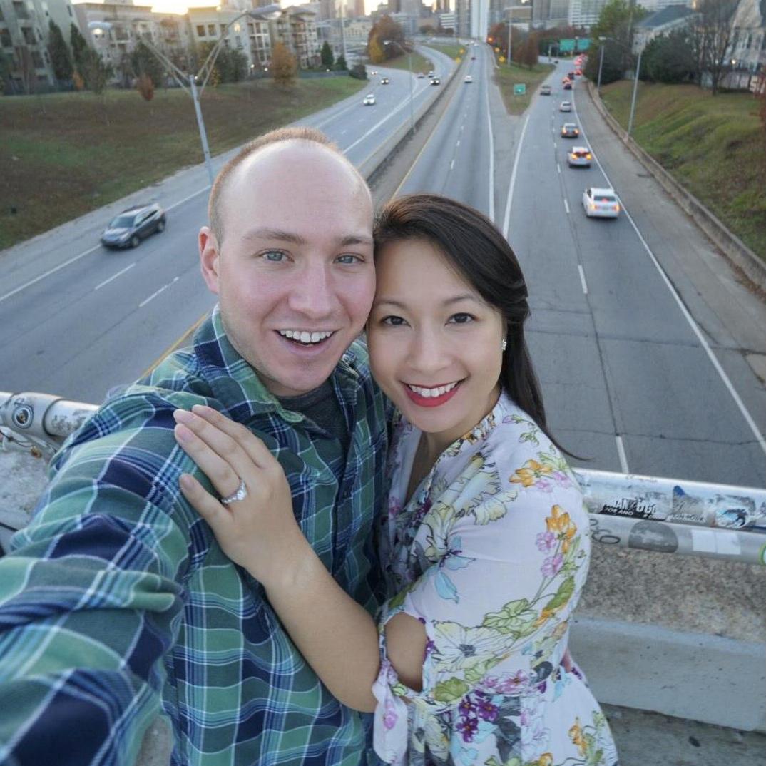 Matt planned for Kim's whole family to be there when he proposed on Jackson St Bridge, overlooking the Atlanta Skyline.  It was perfect!