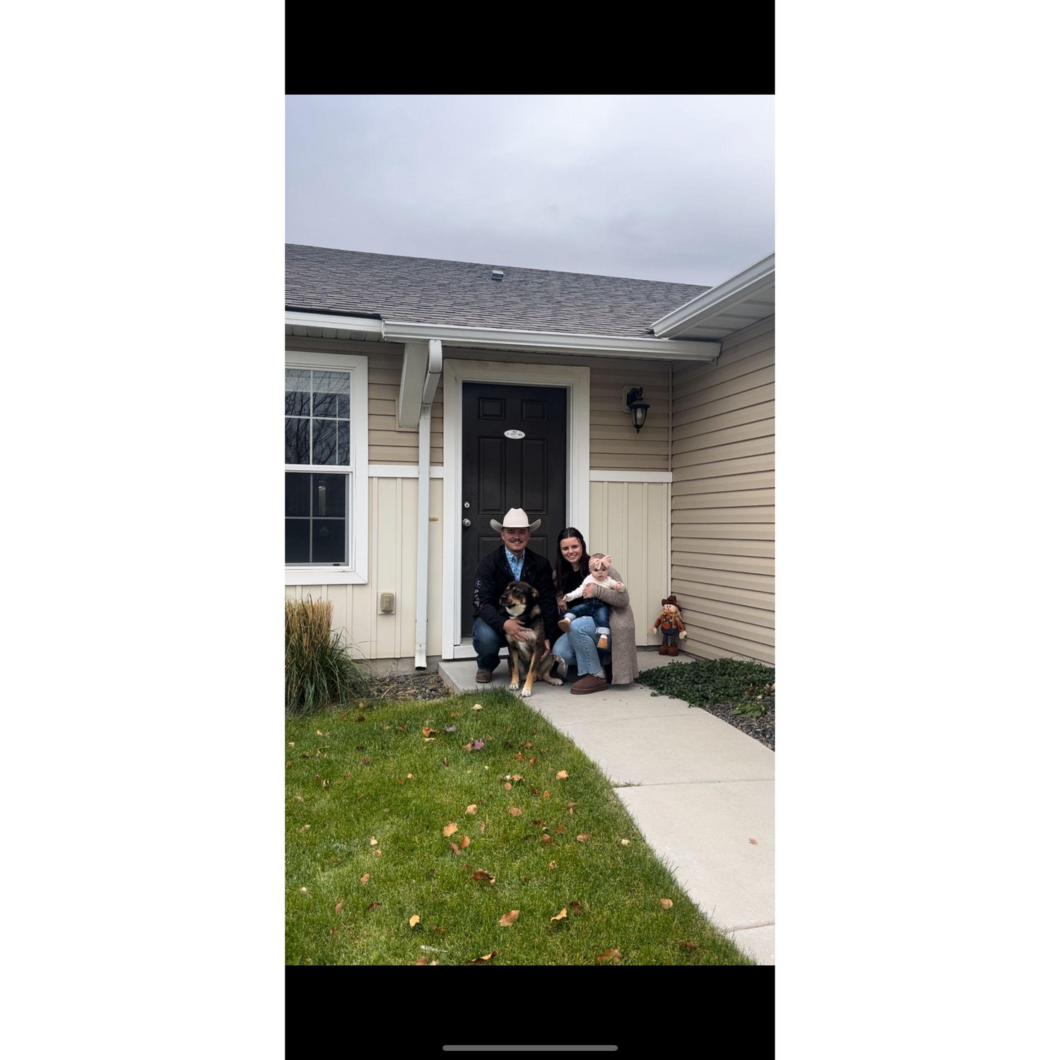 Family photo in front of our first home together!