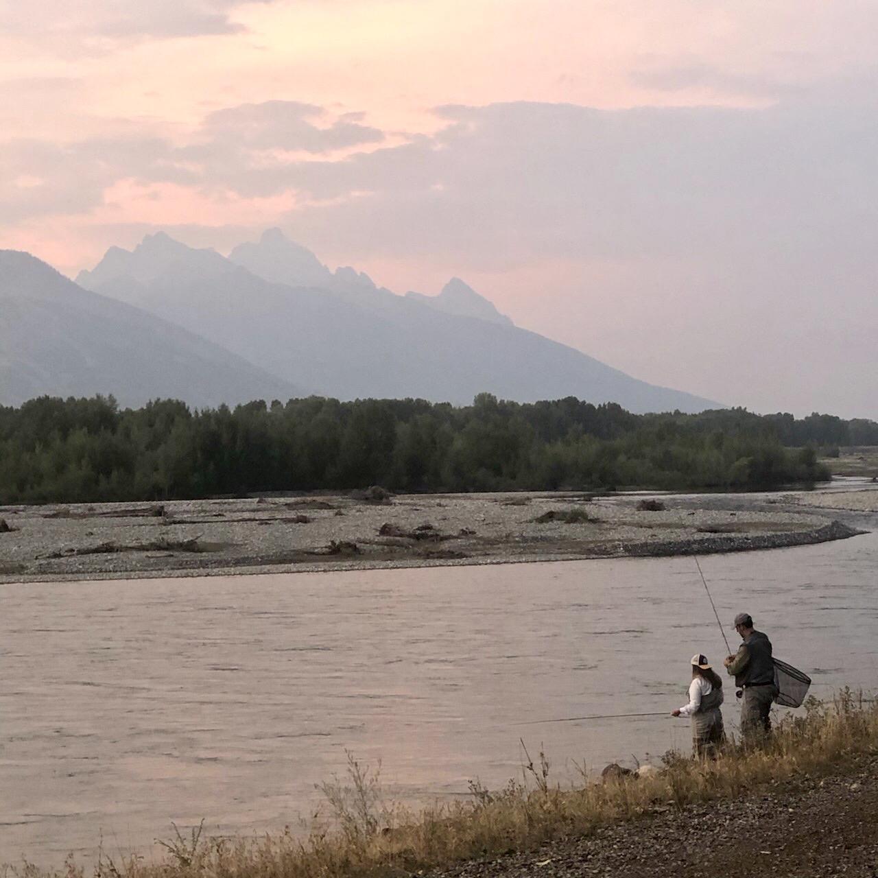Fly fishing the Snake River in Jackson, Wyoming. Photo from a random lady who asked if she could take our picture.