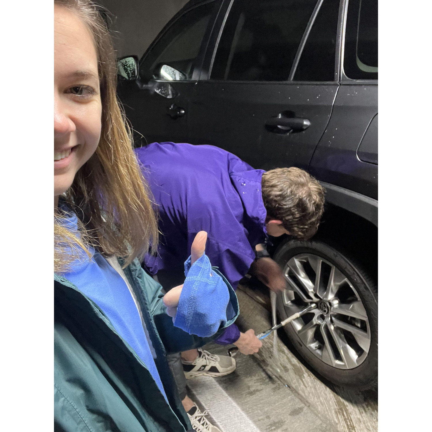 Rhame changing Emily's tire