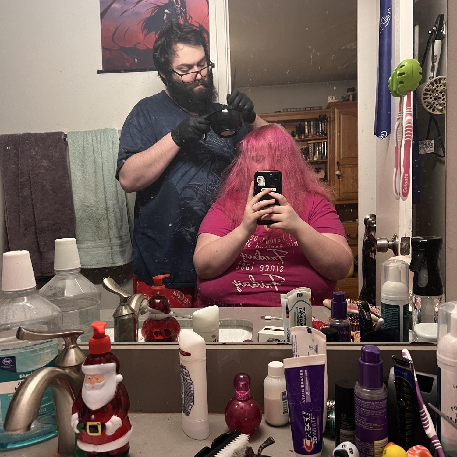 Robert saving us hundreds each time by bleaching and dying Jenni's hair. Look at the focus he has. Jenni also bitches the whole time, and Robert is a great sport. "but did you get that spot?"