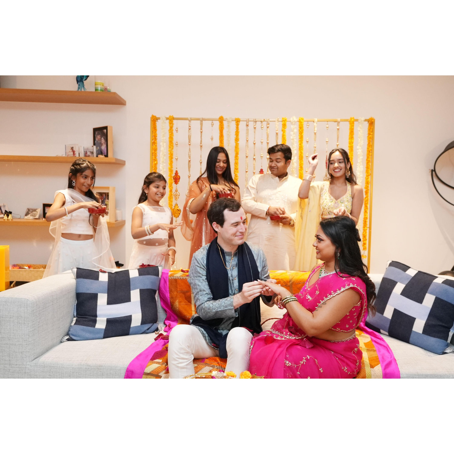 Reevah's cousins and siblings showering us with flowers as we exchange rings.