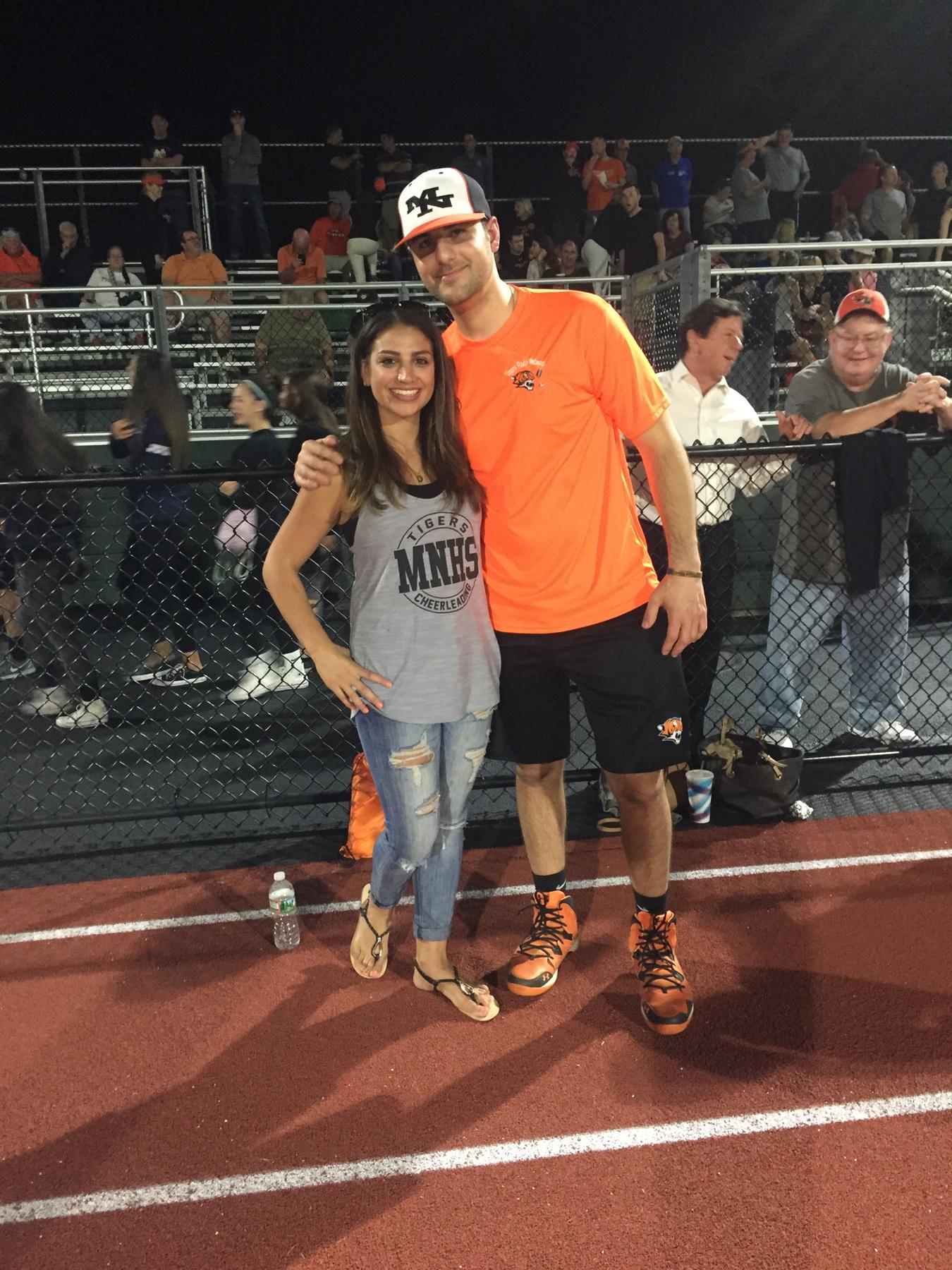While Kim was coaching cheerleading at MNHS, coaches enjoyed going to a local bar, Barnabys after Friday night football games. One night at the bar, the football coaches walked in, and she met Steve!