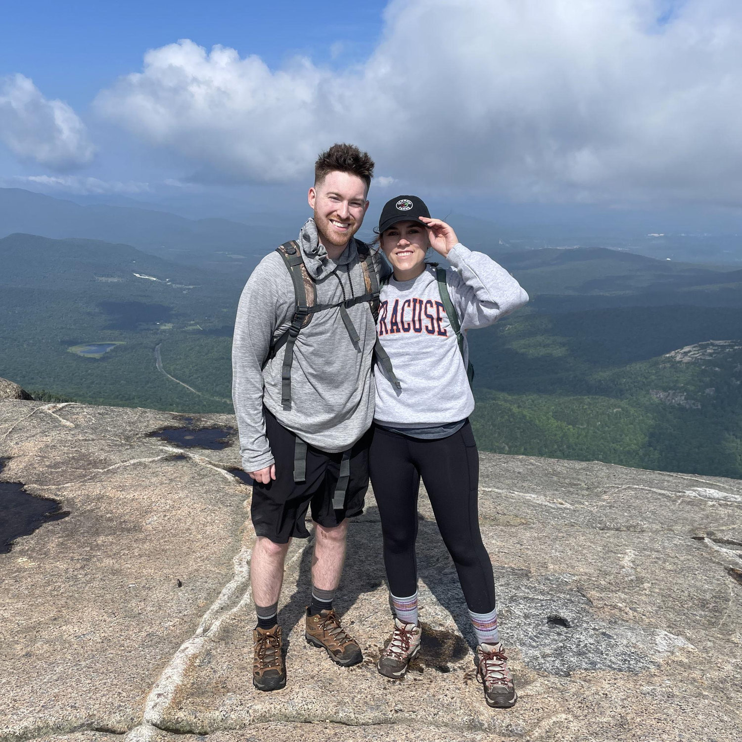 This photo was taken at the summit of Cascade Mountain and our first high peak hike! We climbed in complete cloud cover until the clouds cleared at the summit. Photo taken July 28th, 2023.