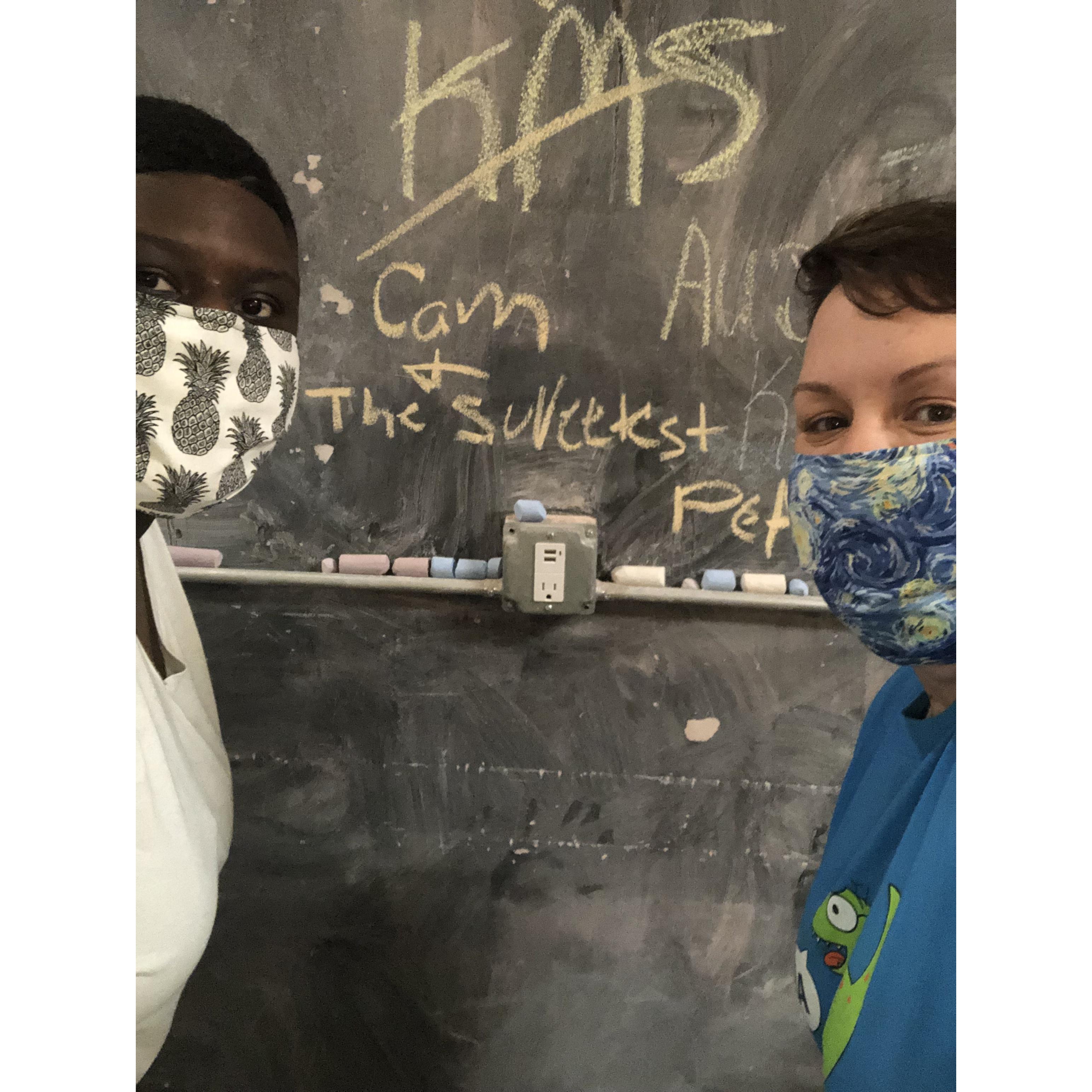 Getting cookies at Baked! of Bloomington. Their walls are chalkboard. The wall says “Cam + The Sweetest Pea”