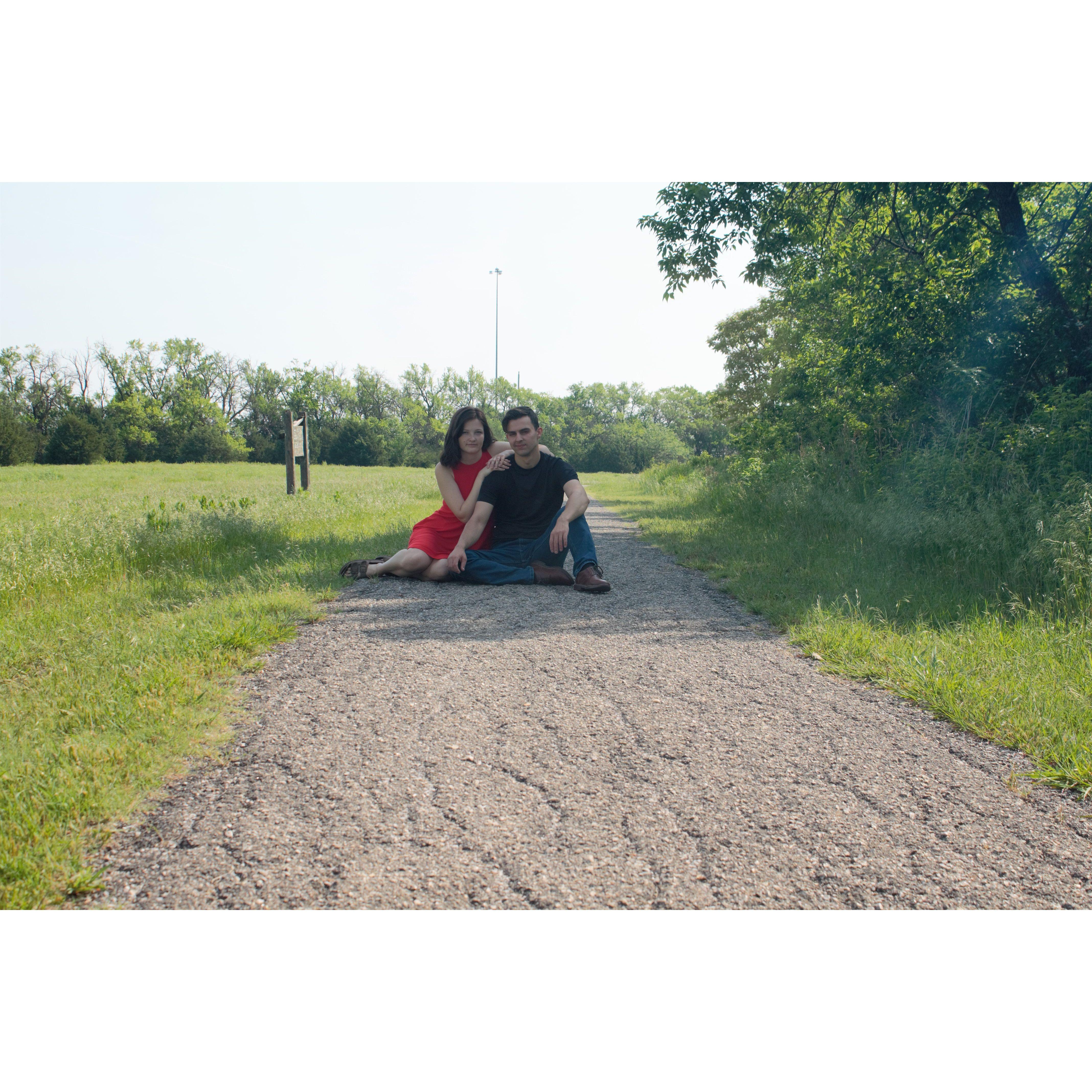 "Happy couple takes break on sidewalk" - istockphoto