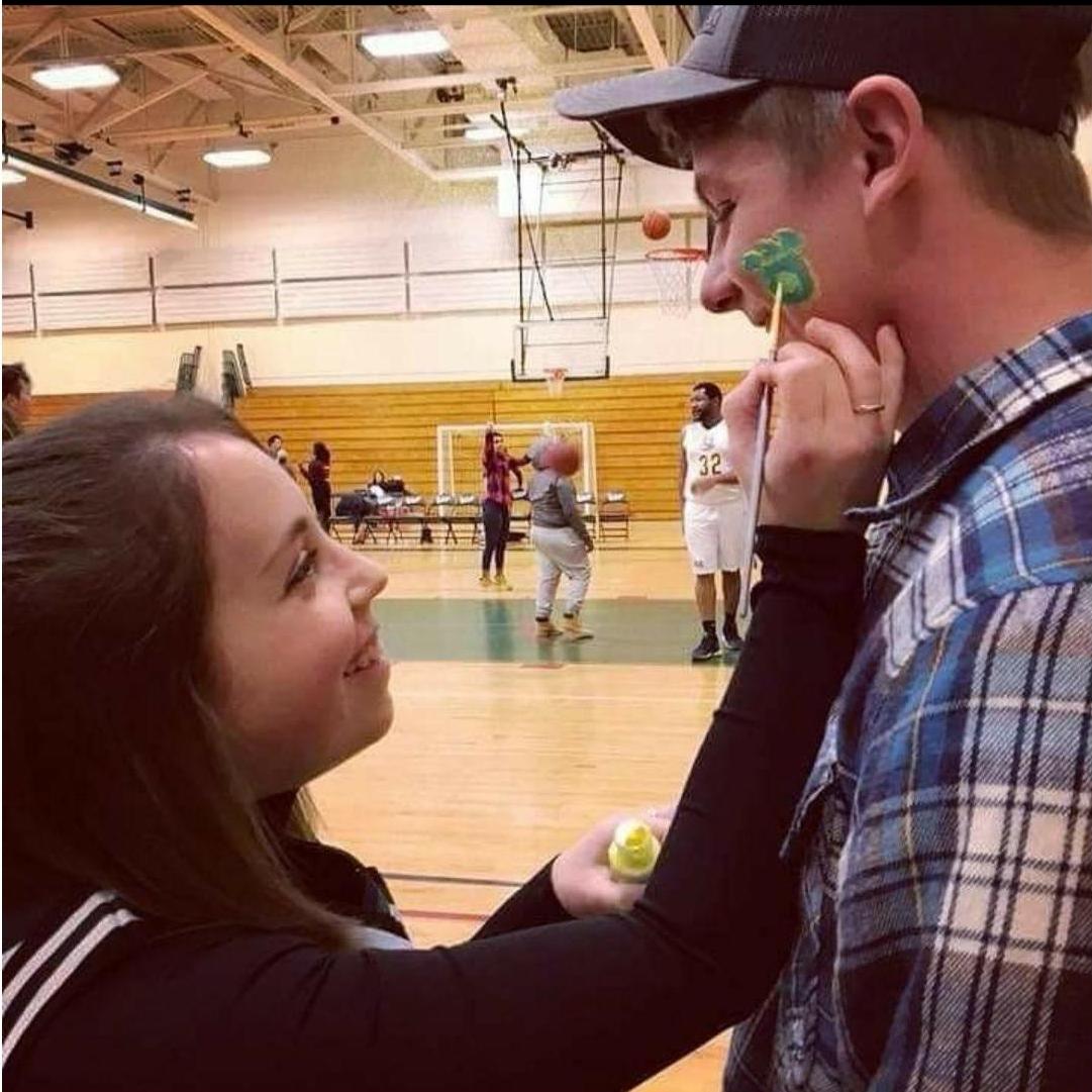 Basketball game at college, I was cheerleading and he was there to watch. Begged him to let me paint his face.