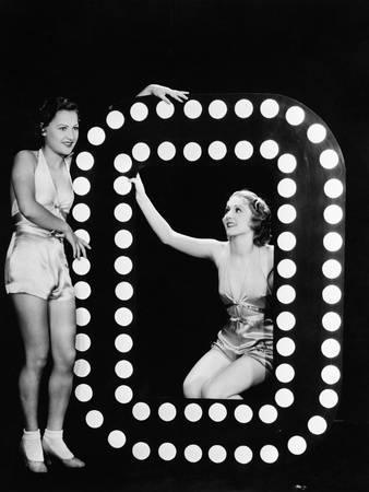 Two Young Women Posing with the Letter O Photographic Print by Everett Collection at Art.com