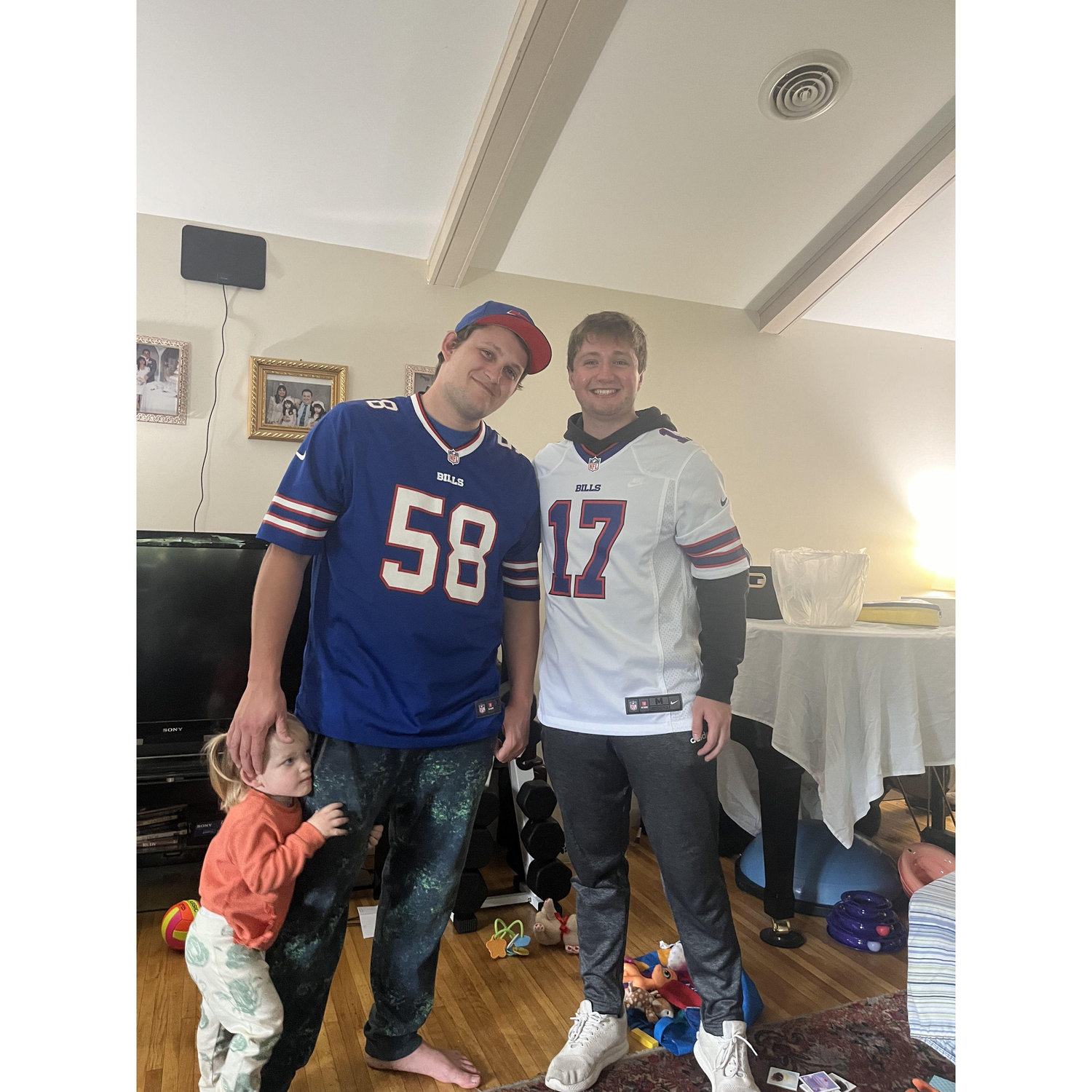 GO BILLS!!!! 
Jacob with one of his groomsmen (Sam) and one of the flower girls (Emmanuella).