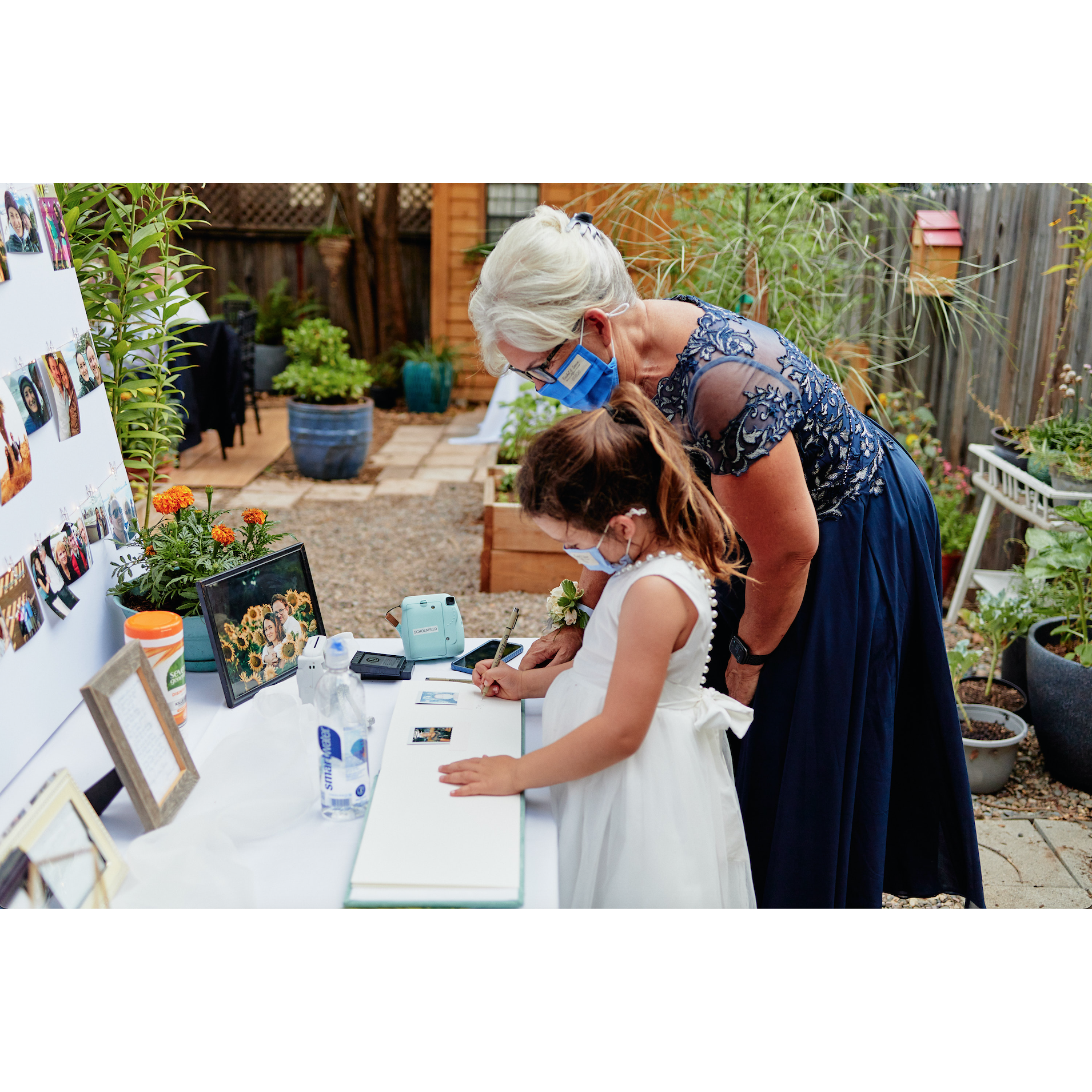 Rachel's mother, Betsy, and niece, Sofia, signing the guest book