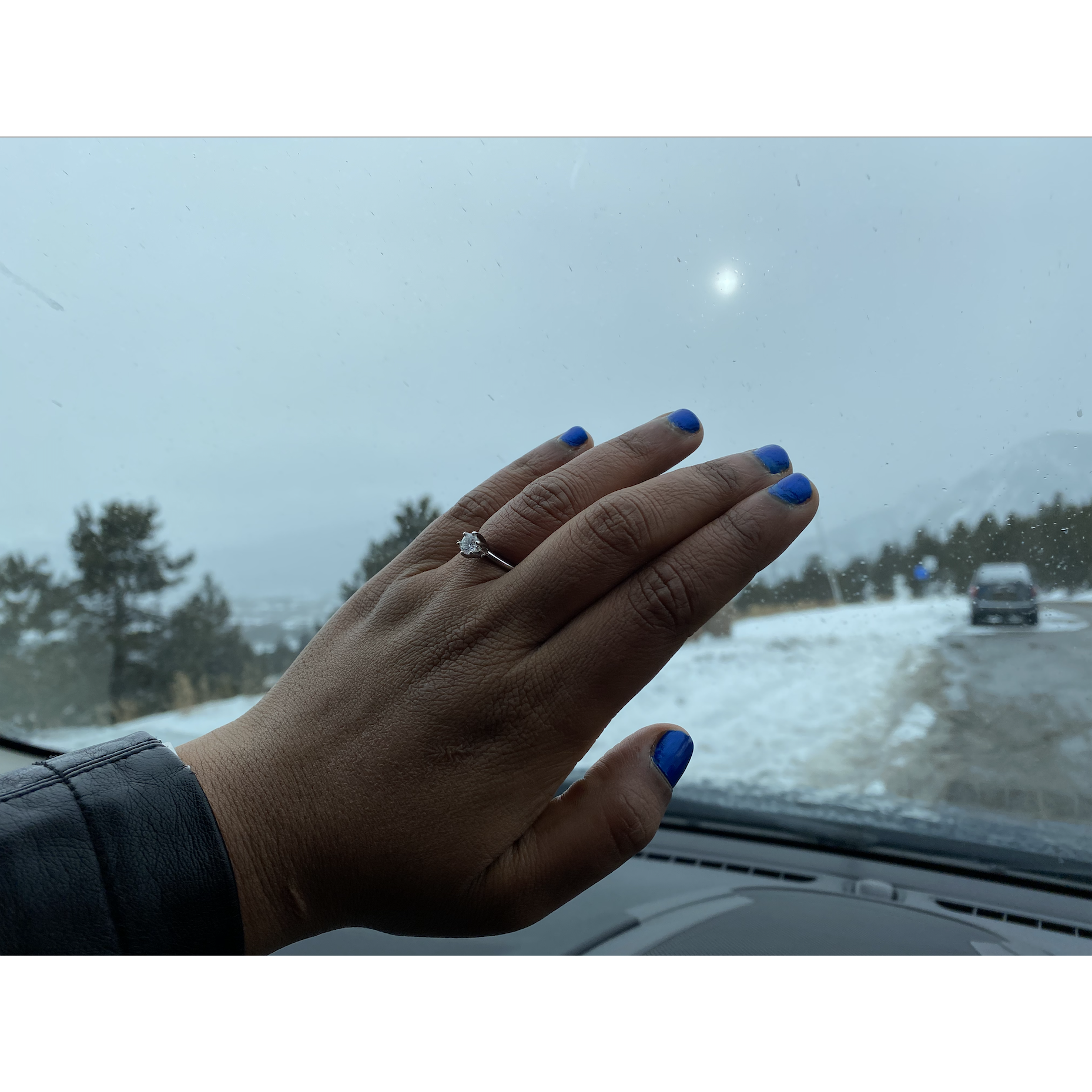 After fully convincing me that the candy ring was all I was getting, he went down on one knee atop the summit at Frisco