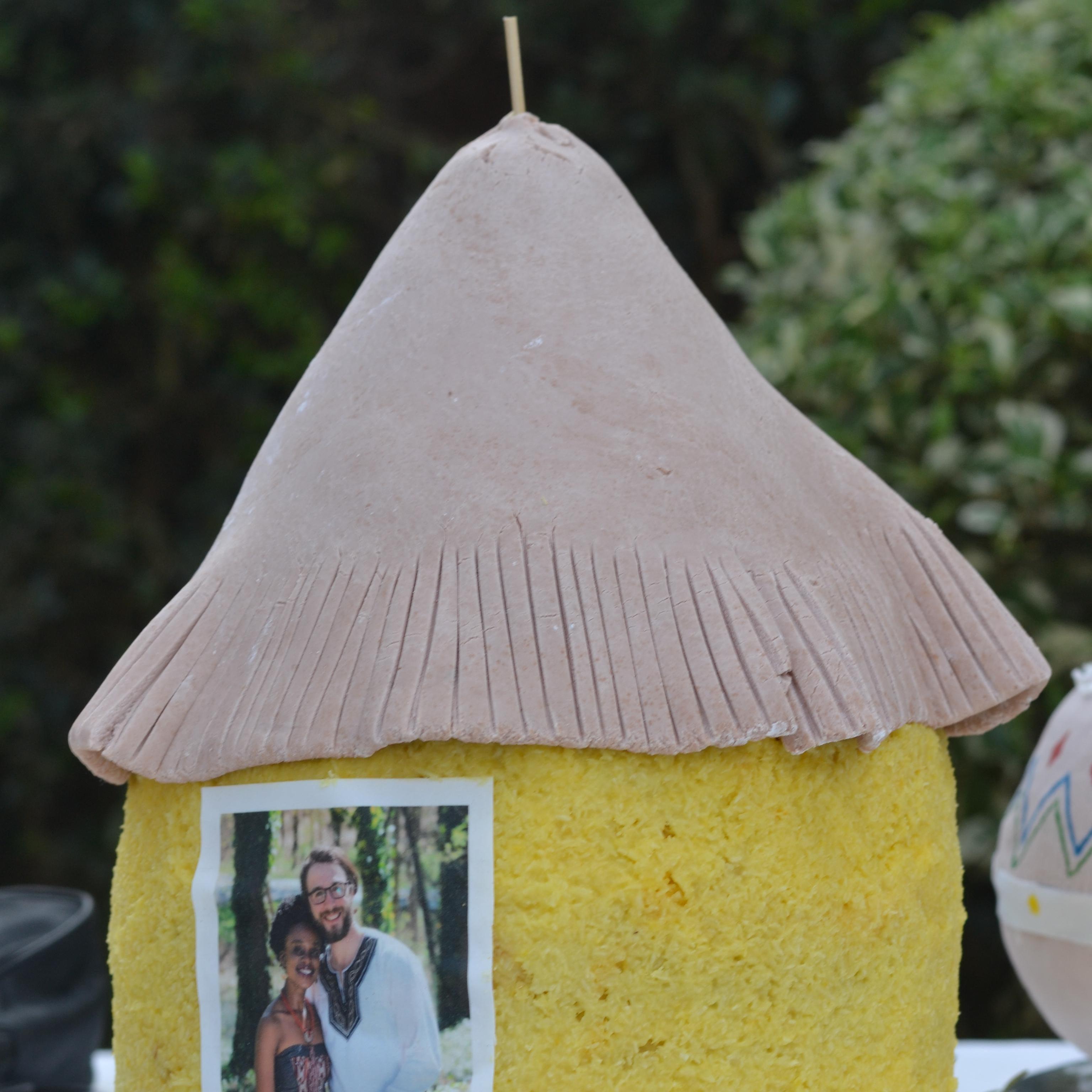 one of the cakes that was cut during our farewell ceremony in Kenya...it is in the shape of a lone mud hut and thatched roof ; the traditional Kenyan symbol of a young man's first independent home.