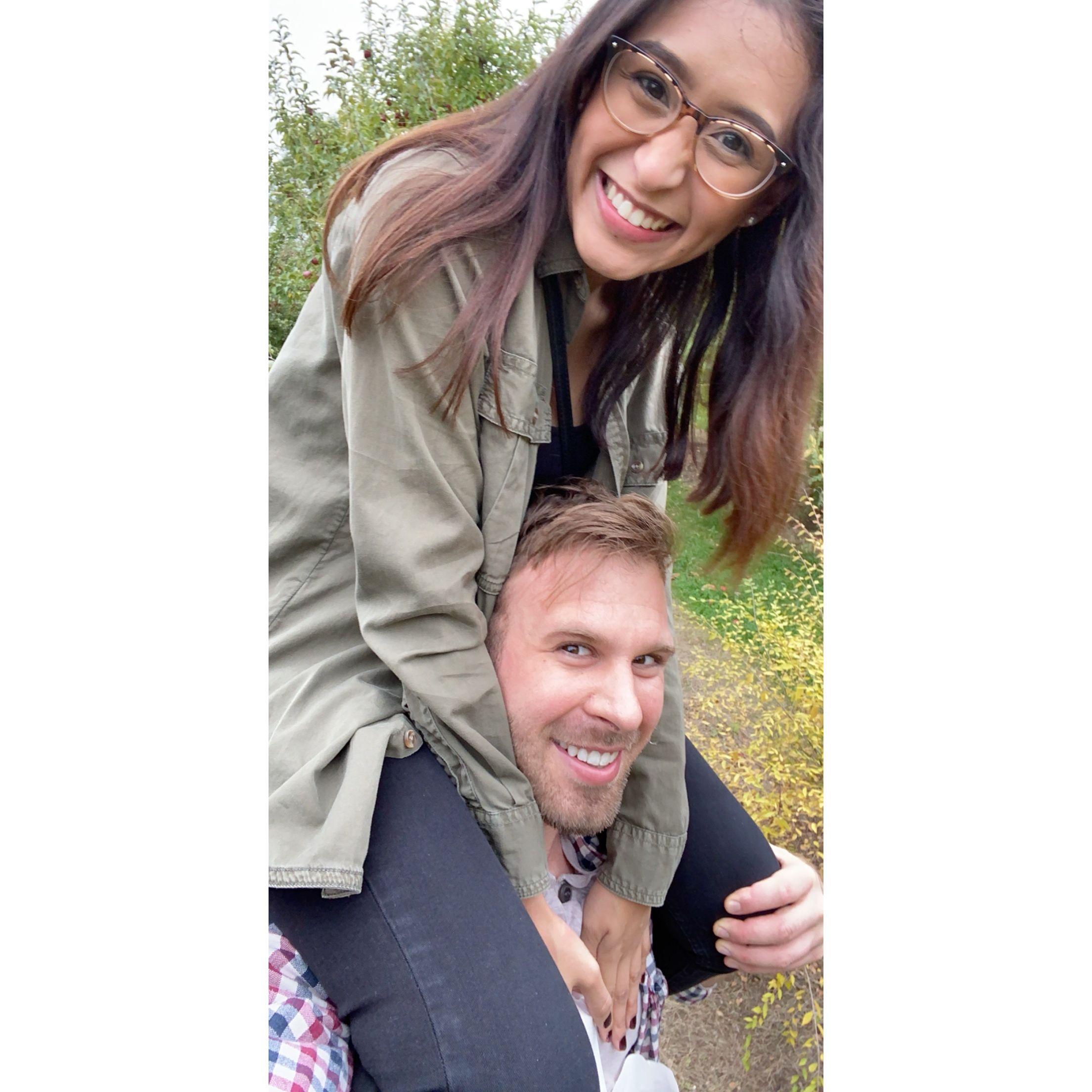 Us in the fall, doing one of our favorite activities, picking apples so I can make a bomb apple pie