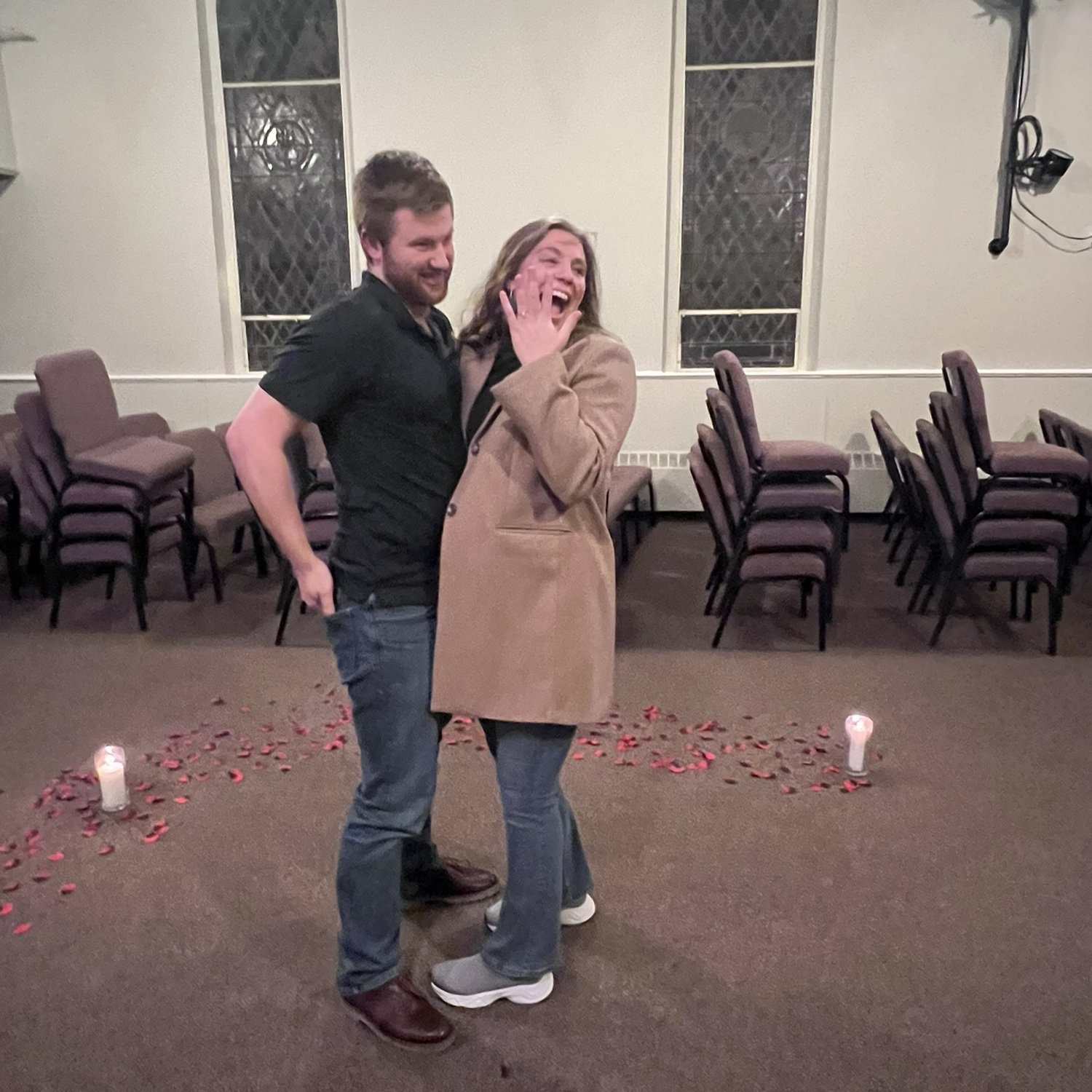 Our families bursting through the doors after Jacob proposed!