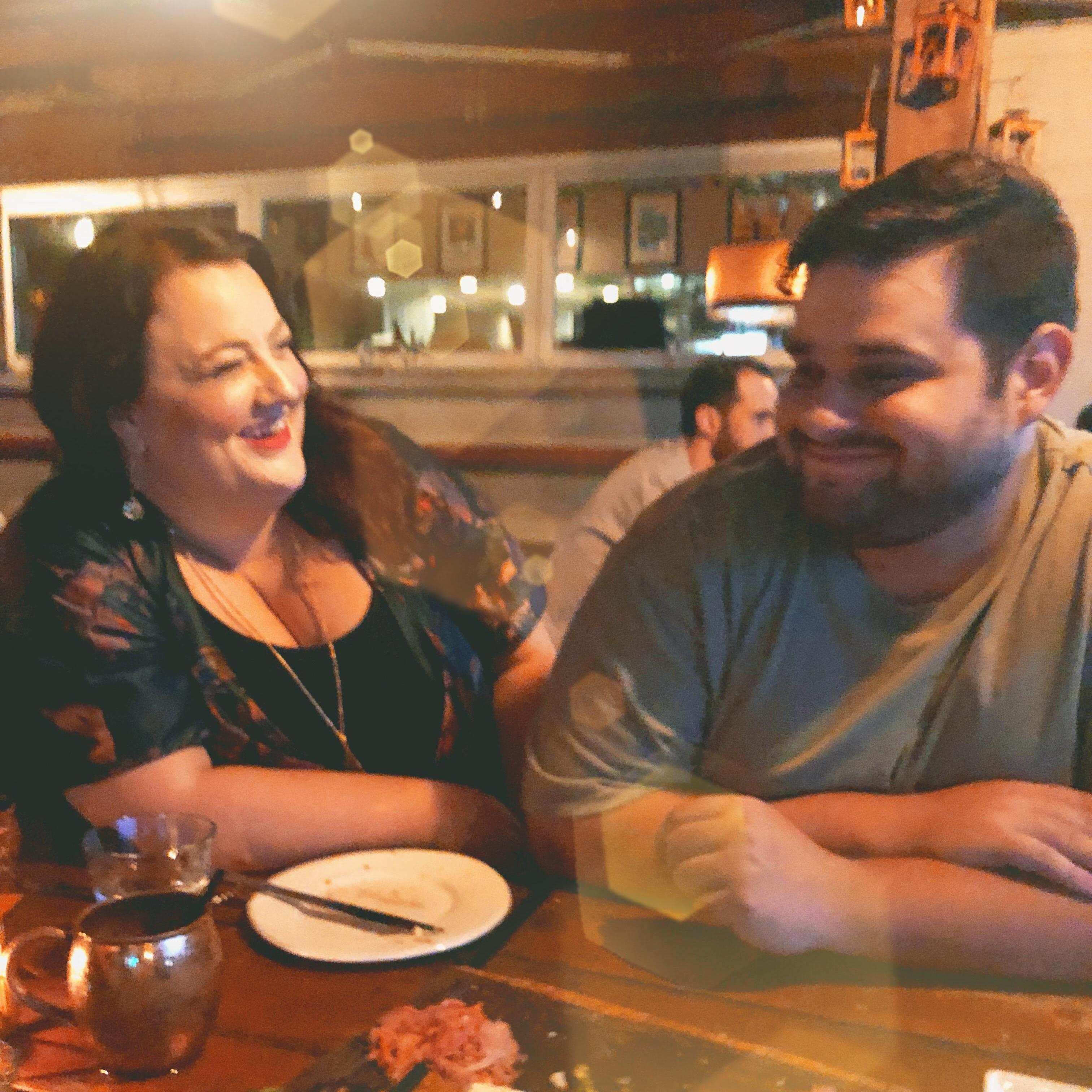 At dinner just hours before we got engaged!