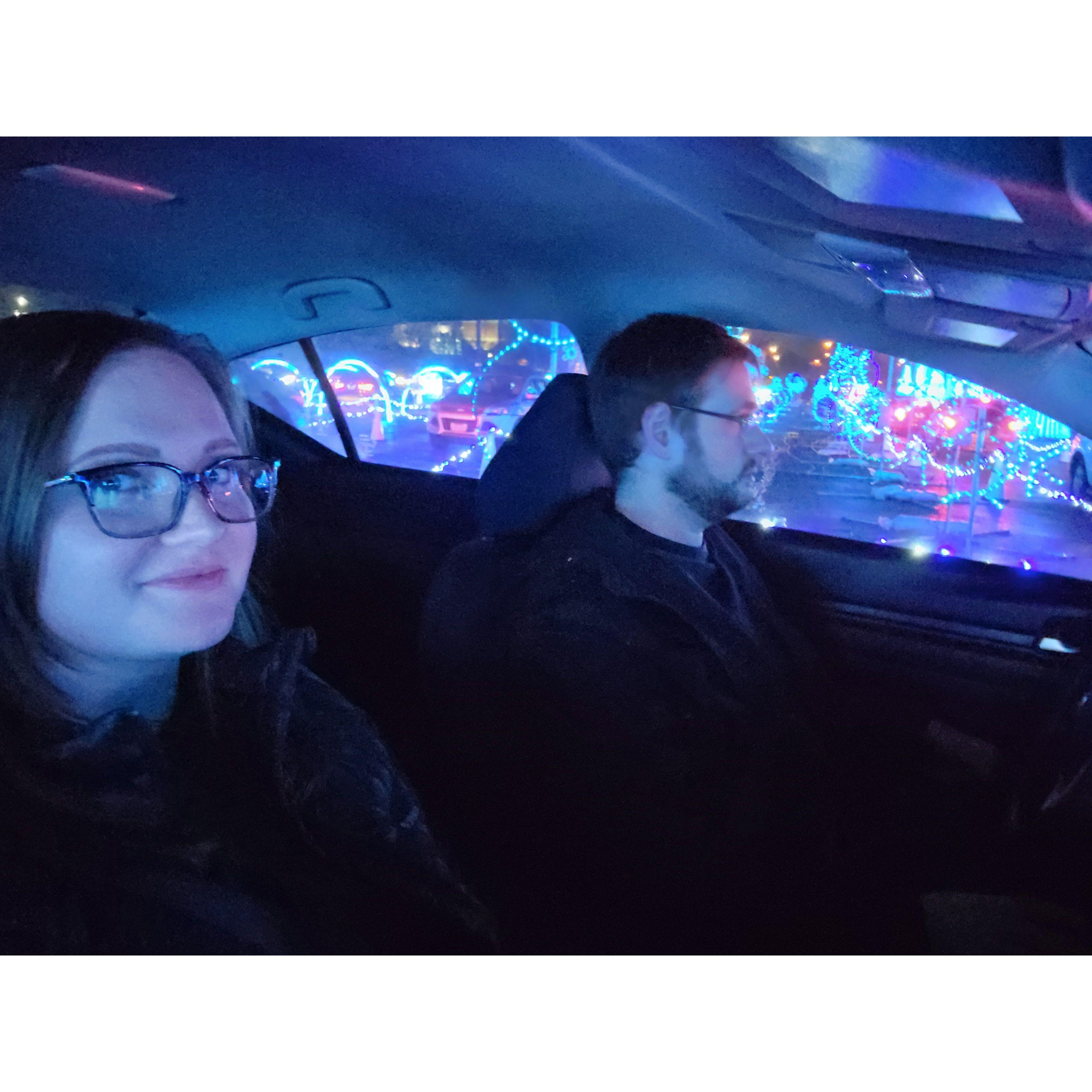 Our first photo together while driving through a light show.