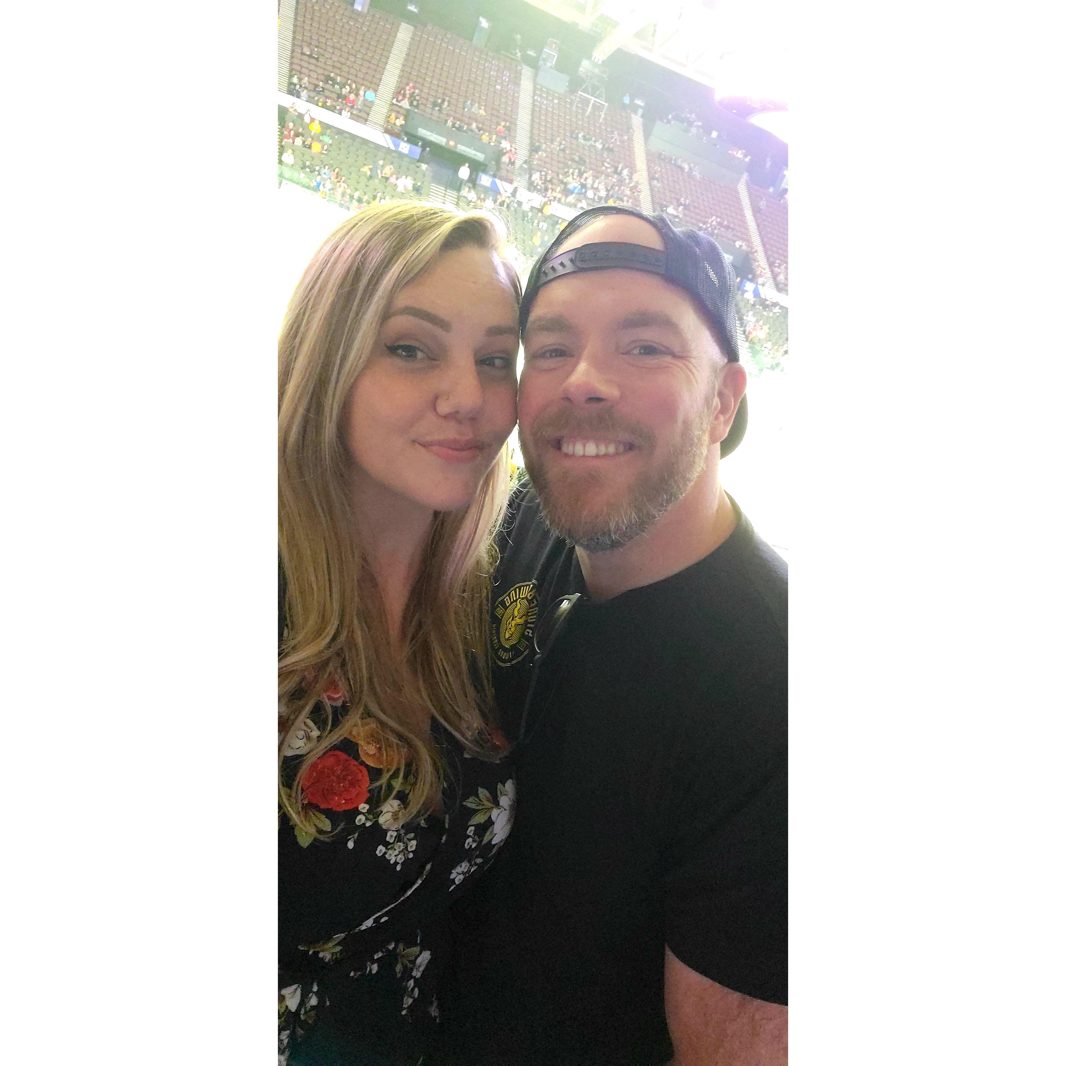 Our very first picture together at our first hockey game together