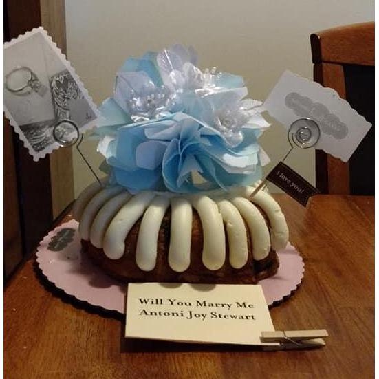 When Michael proposed, the ring was on top of this cake! Michael knows Antoni (and her love of cake) so well!! Of course he was down on one knee :)