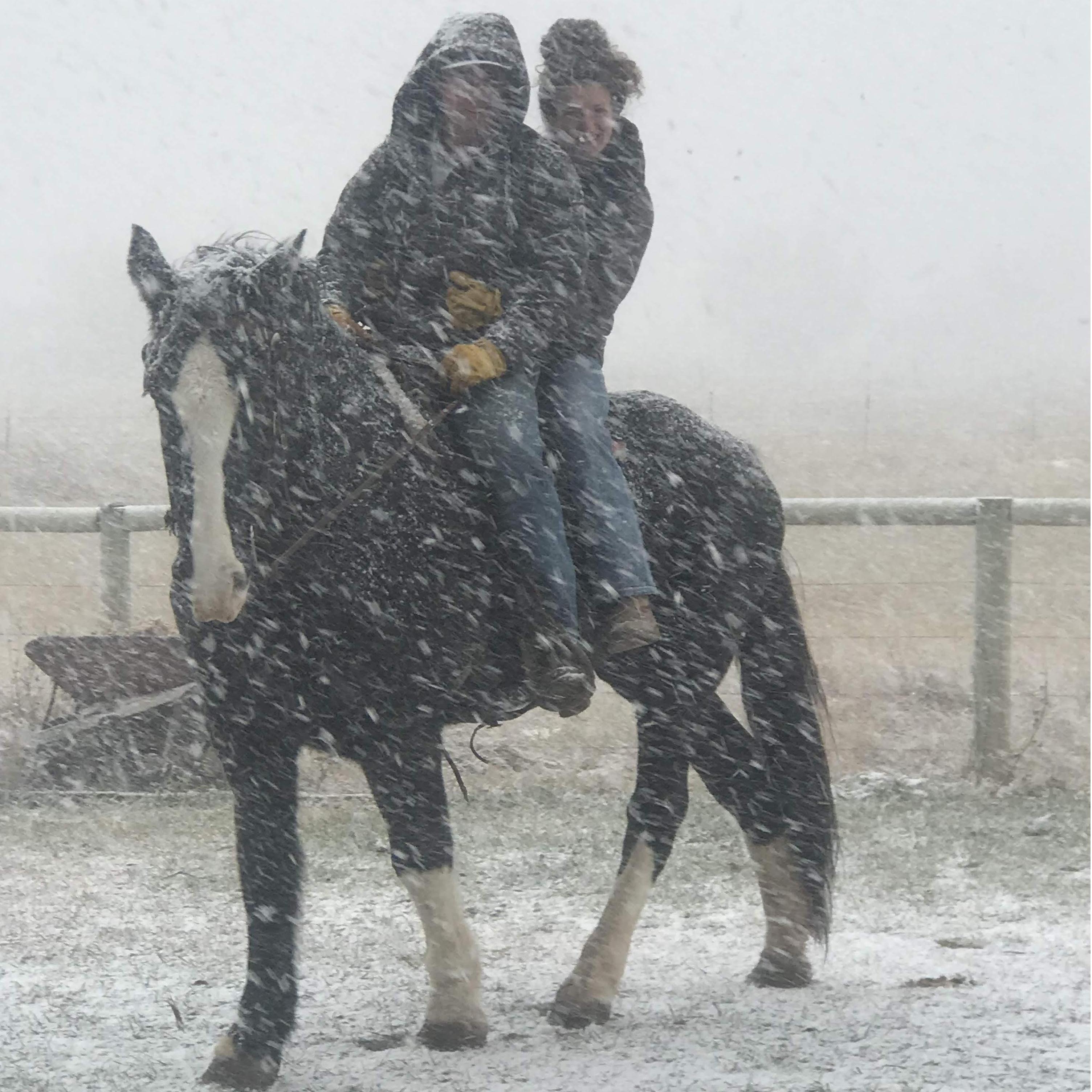 Nothing will stop these two from riding, not even a snowstorm!